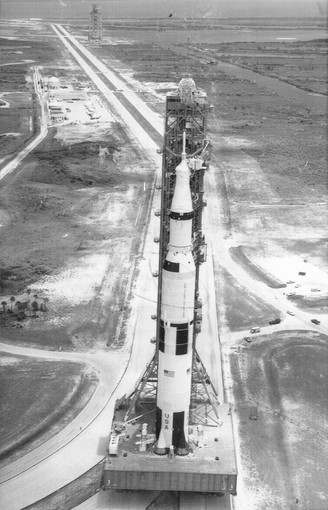 The Apollo 11 space capsule riding atop its Saturn V...