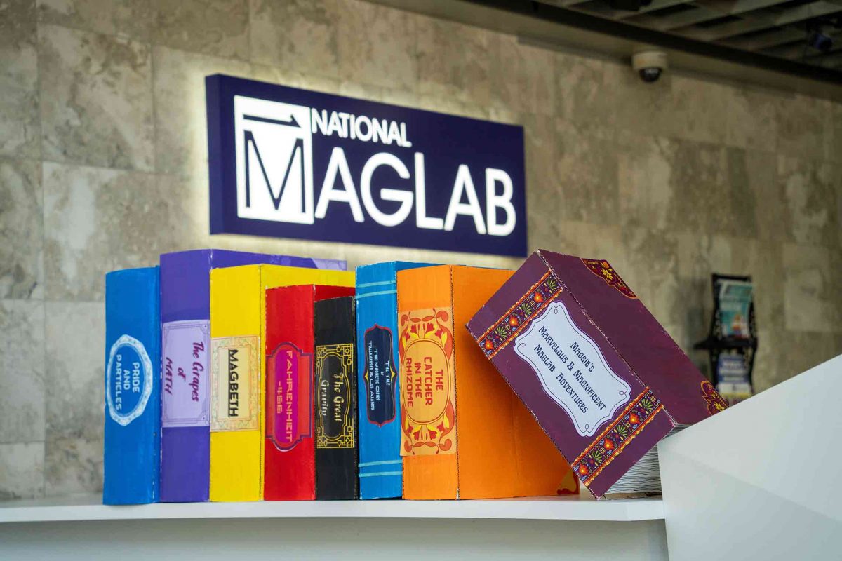 Photo of books below the National Maglab sign to promote the 2026 open house.