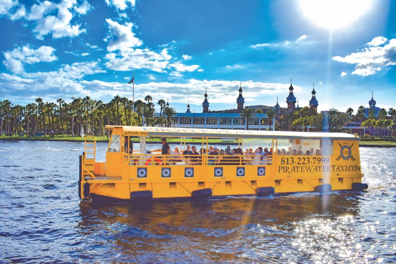 Tampa Pirate Water Taxi tour cruising on the Hillsborough River past the historic University of Tampa Plant Hall.