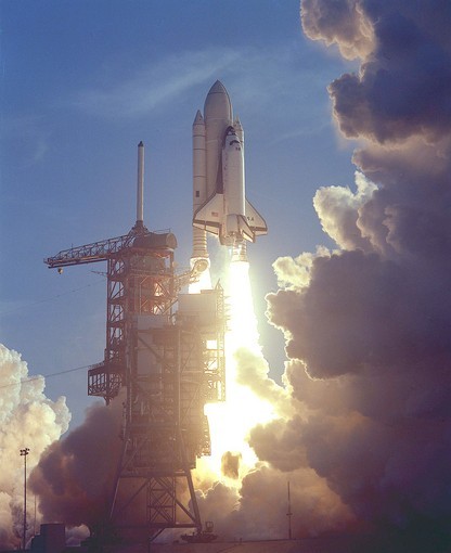 NASA's Space Shuttle Columbia (STS-1) rises above Launch Complex 39's...