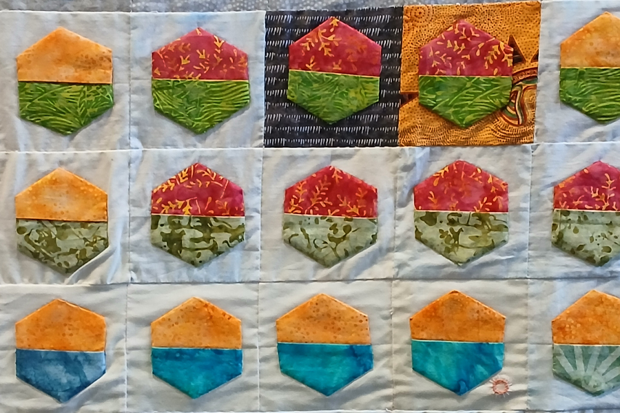 A set of squares from a quilt showing weather data.