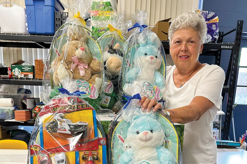 Vickie Robinson packs up Easter baskets for children involved with Family Promise