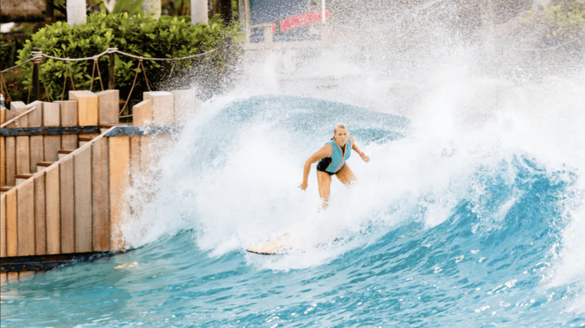 A woman surfing in the wave pool at Typhoon Lagoon.