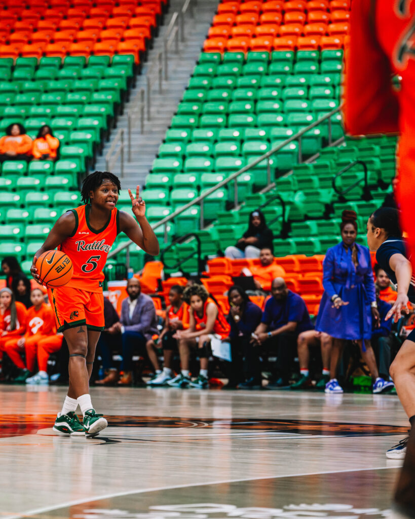 The current image has no alternative text. The file name is: Senior-Camille-Jackson-dribble-ball-down-the-court.--scaled.jpg