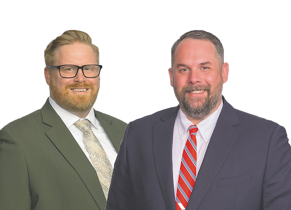 Two associate attorneys promoted to partner at Taylor, Day, Grimm & Boyd