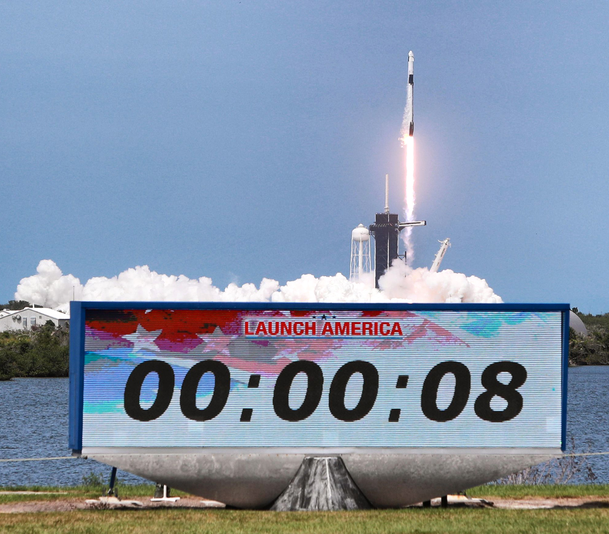 The SpaceX Falcon 9 rocket carrying astronauts Doug Hurley and...