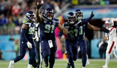 Seattle Seahawks Byron Murphy II (91), Devon Witherspoon (21), and the Seahawks defense celebrate after Murphy recovered a fumble after a sack during the third quarter of Super Bowl 60 in Santa Clara, Calif., Sunday, Feb. 8, 2026. (Scott Strazzante/San Francisco Chronicle via AP)