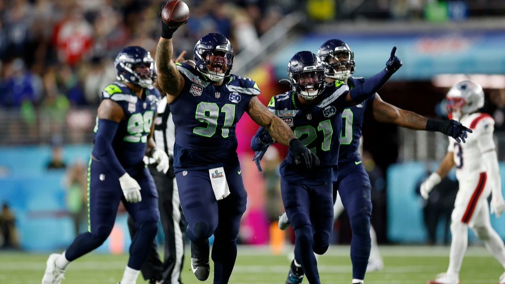 Seattle Seahawks Byron Murphy II (91), Devon Witherspoon (21), and the Seahawks defense celebrate after Murphy recovered a fumble after a sack during the third quarter of Super Bowl 60 in Santa Clara, Calif., Sunday, Feb. 8, 2026. (Scott Strazzante/San Francisco Chronicle via AP)