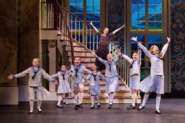 (on staircase) Cayleigh Capaldi (Maria Rainer) with the von Trapp Children (l to r) Haddie Mac (Brigitta), Luciana VanDette (Gretl), Benjamin Stasiek (Kurt), Ruby Caramore (Marta), Ava Davis (Louisa), Eli Vander Griend (Friedrich), Ariana Ferch (Liesl) in "The Sound of Music." (Jeremy Daniel/Courtesy)