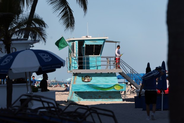 The lifeguard tower at Terremar Street on Fort Lauderdale beach, Tuesday, Feb. 10, 2026, is part of the newly completed Lifeguard Tower Public Art Project, featuring murals by artist Timothy Robert Smith. (Mike Stocker/South Florida Sun Sentinel)