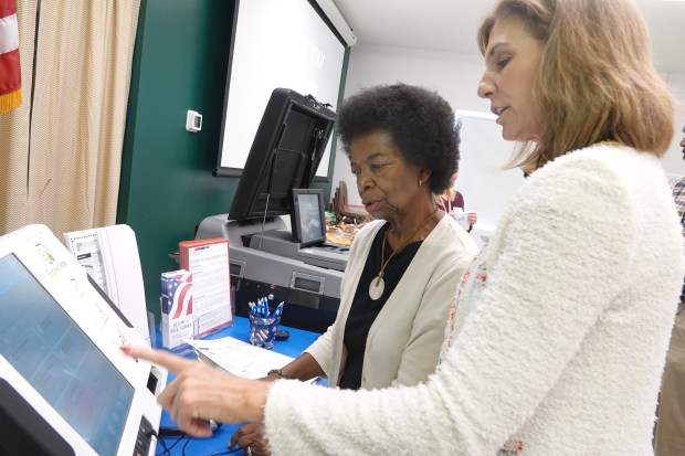 Palm Beach County Supervisor of Elections Wendy Sartory Link demonstrates the the ExpressVote system to Kay Brown of the Classroom Teacher\'s Association on Feb. 4, 2020. The county has been using the system at early voting centers in recent locations and it has been well received, Link said. (Joe Cavaretta/South Florida Sun Sentinel)