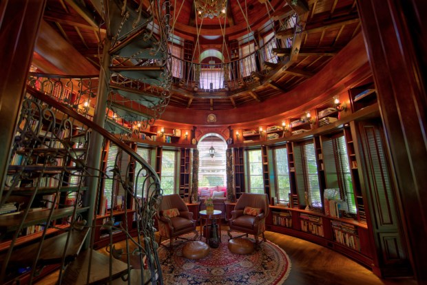 The estate features three spiral staircases, including this one in the library.(Courtesy of Saunders Real Estate)