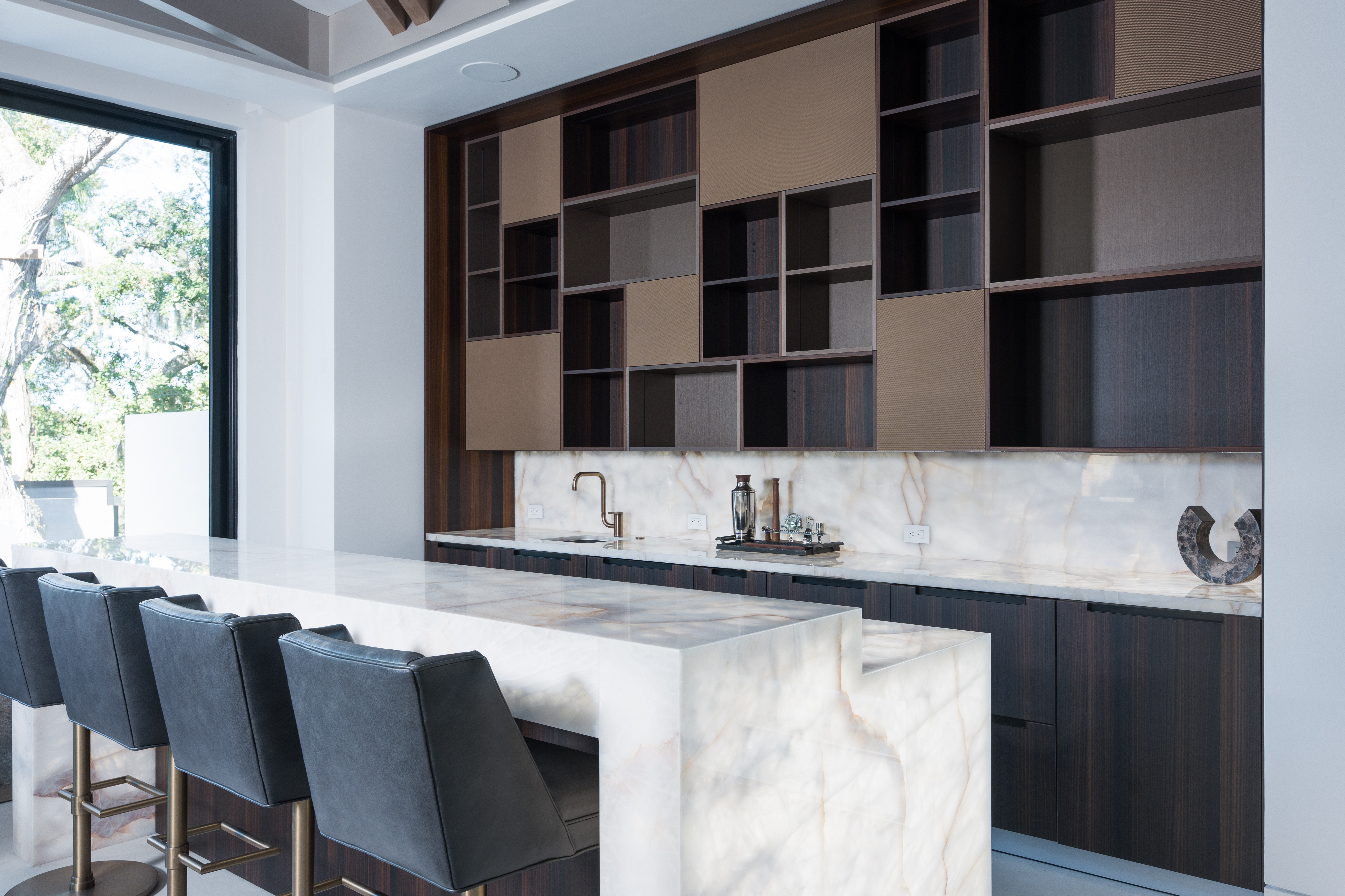 The bar was installed with LED lighting underneath the Dekton...
