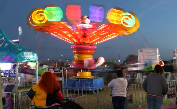 Colorful rides are pictured during the Central Florida Fair at the fairgrounds in Orlando on Tuesday, March 4, 2025. The Central Florida Fair, in its 113th year, features a midway with rides, games, food, live music and entertainment, livestock exhibits and more. (Stephen M. Dowell/Orlando Sentinel)