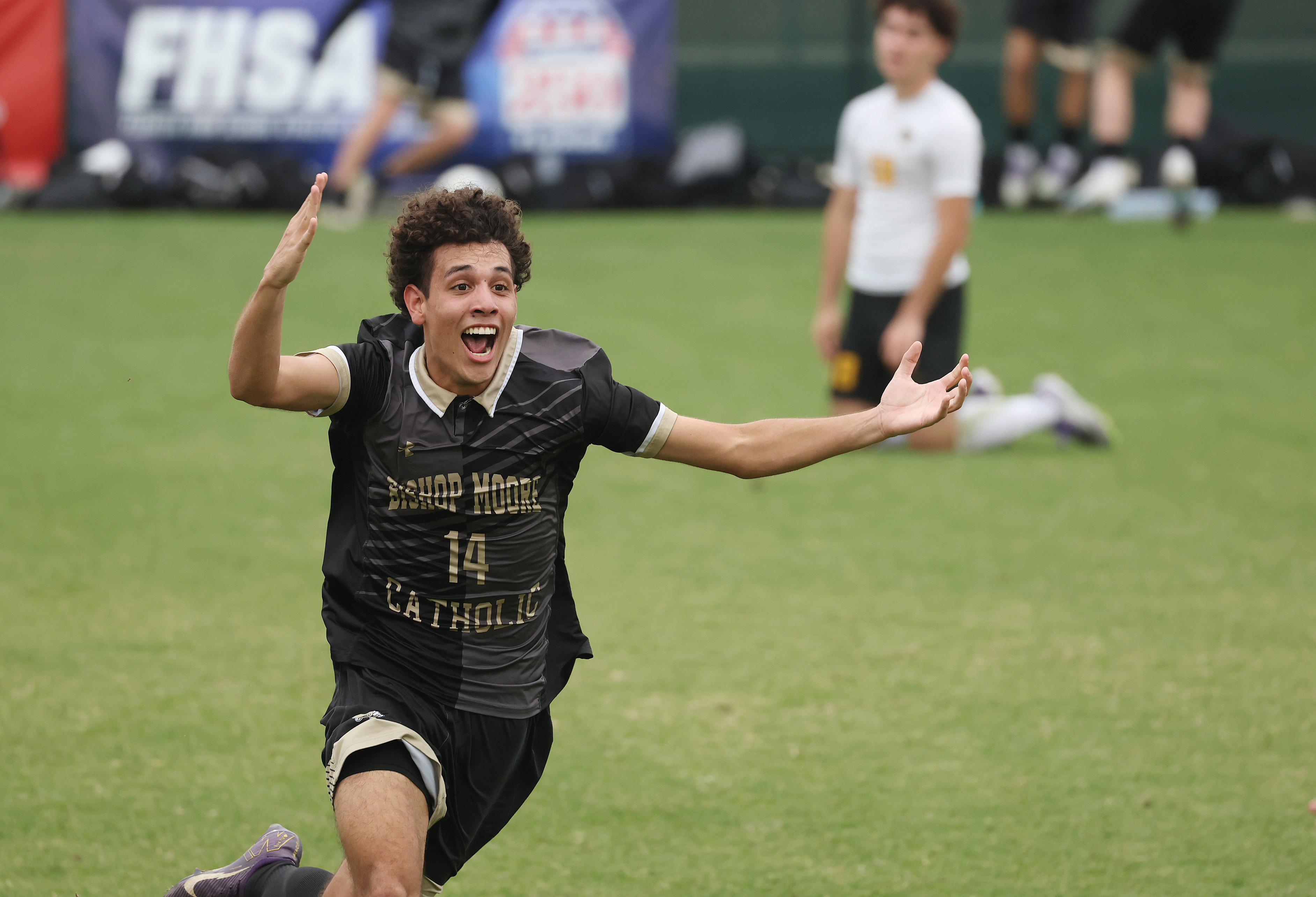 Bishop Moore Catholic High School soccer player Eddie Benitez (14)...