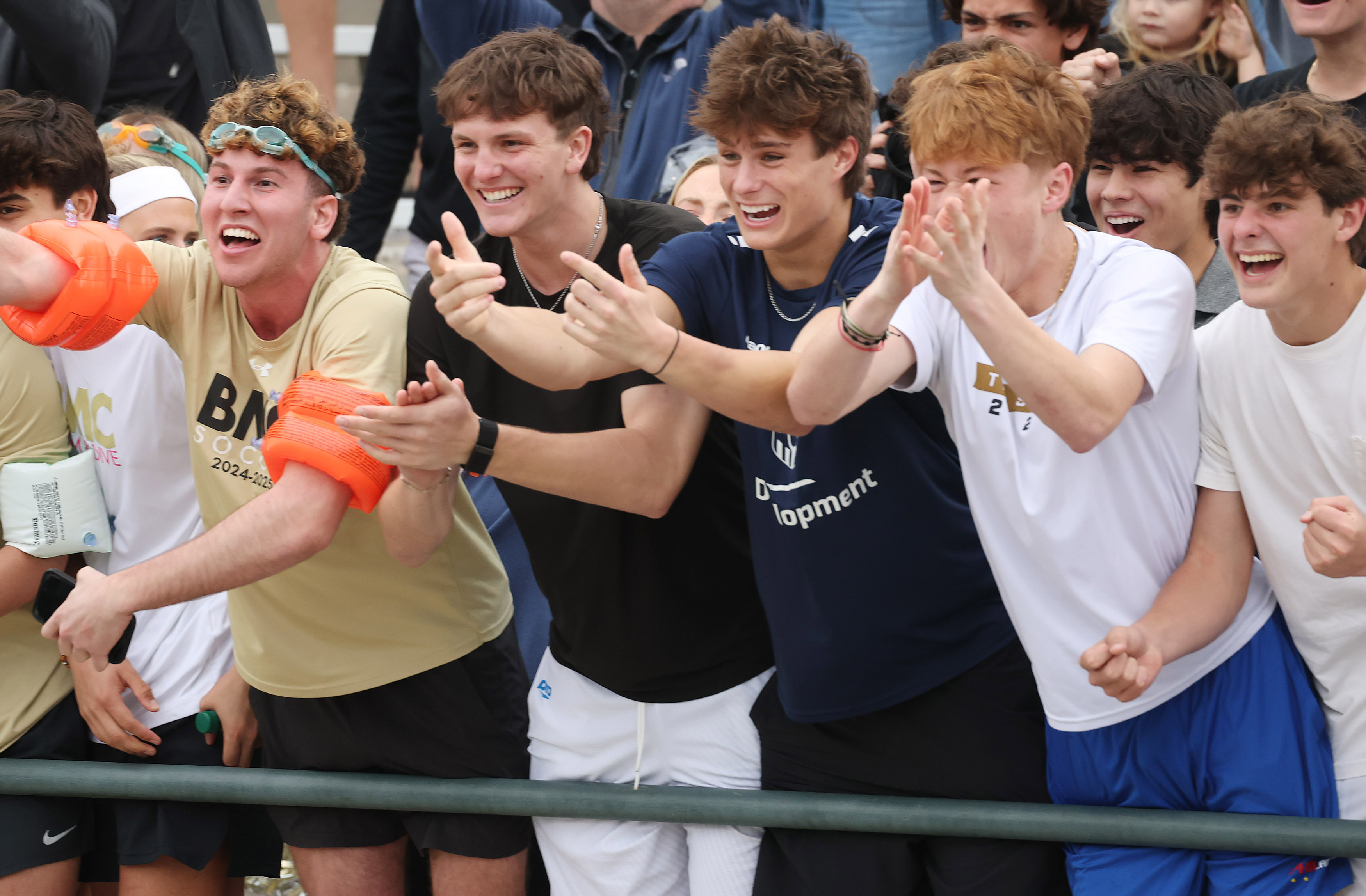 Bishop Moore Catholic High School students celebrate after the boys...