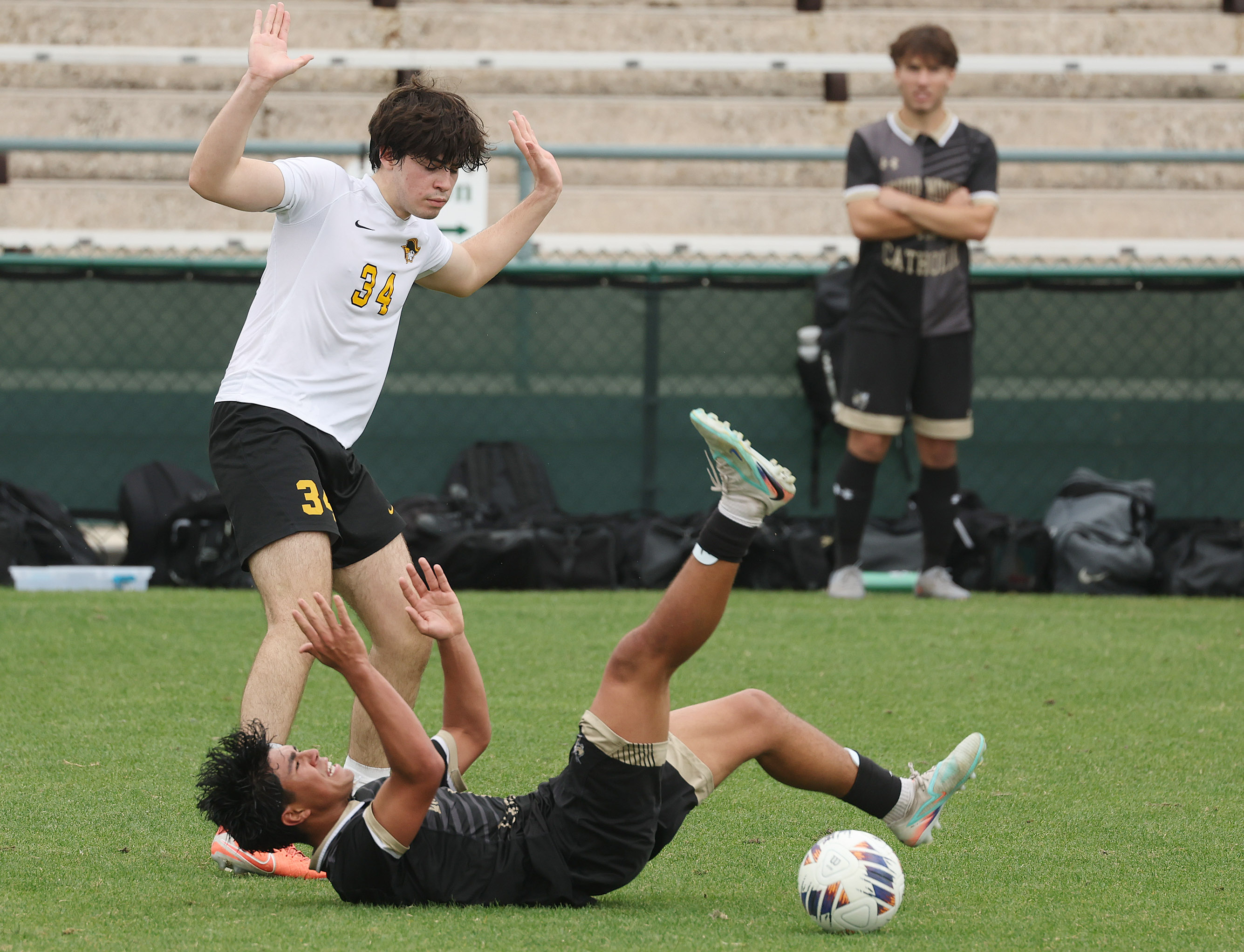 Bishop Moore Catholic High School soccer player Matias Guerrero (bottom)...