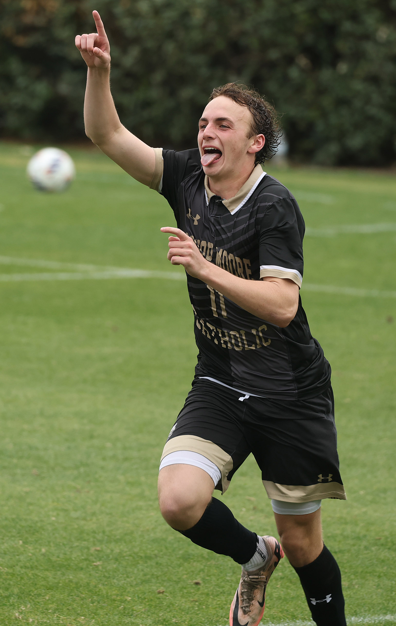 Bishop Moore Catholic High School soccer player Winston Weibel celebrates...