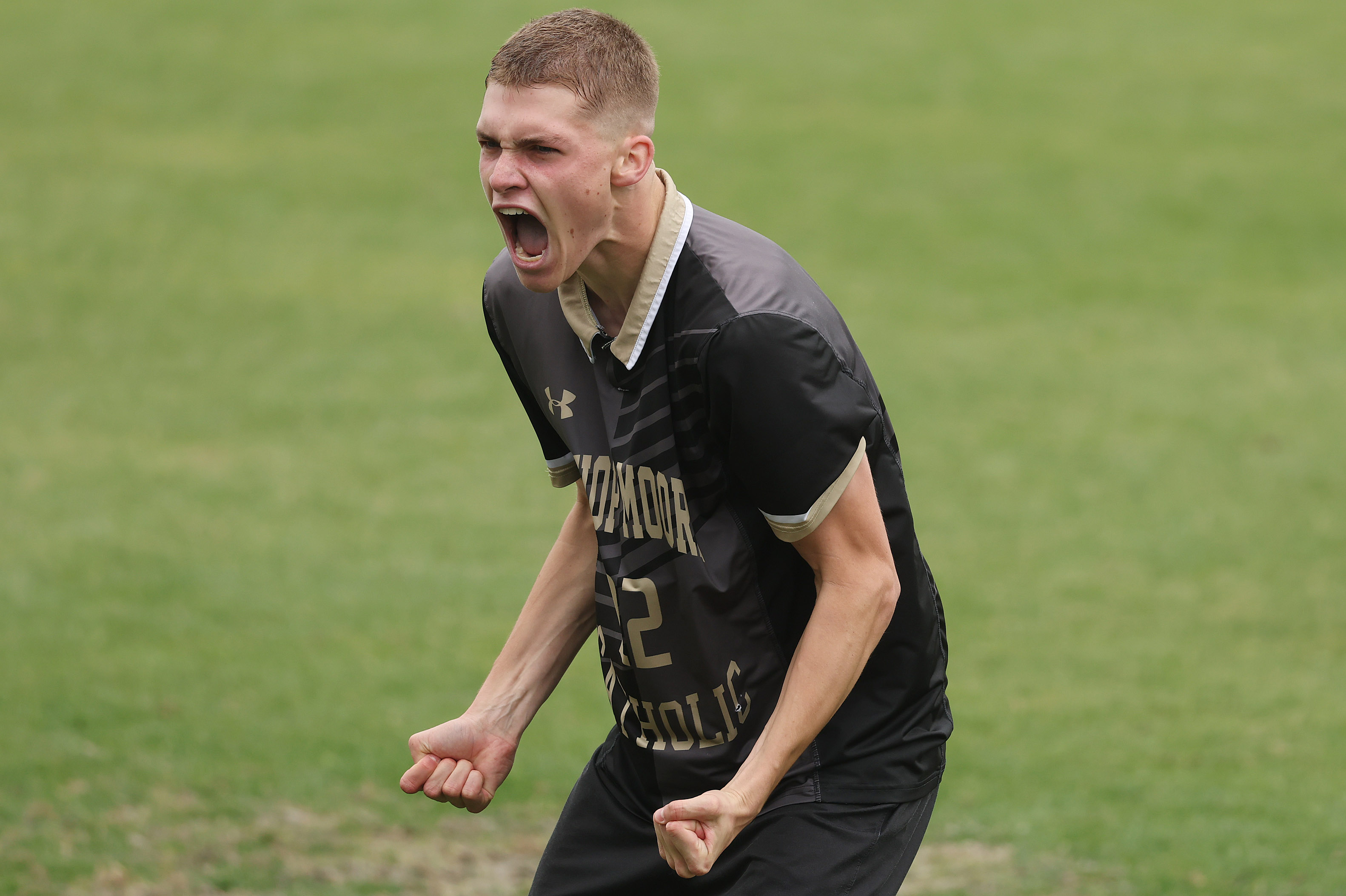 Bishop Moore Catholic High School soccer player Cooper Ball celebrates...