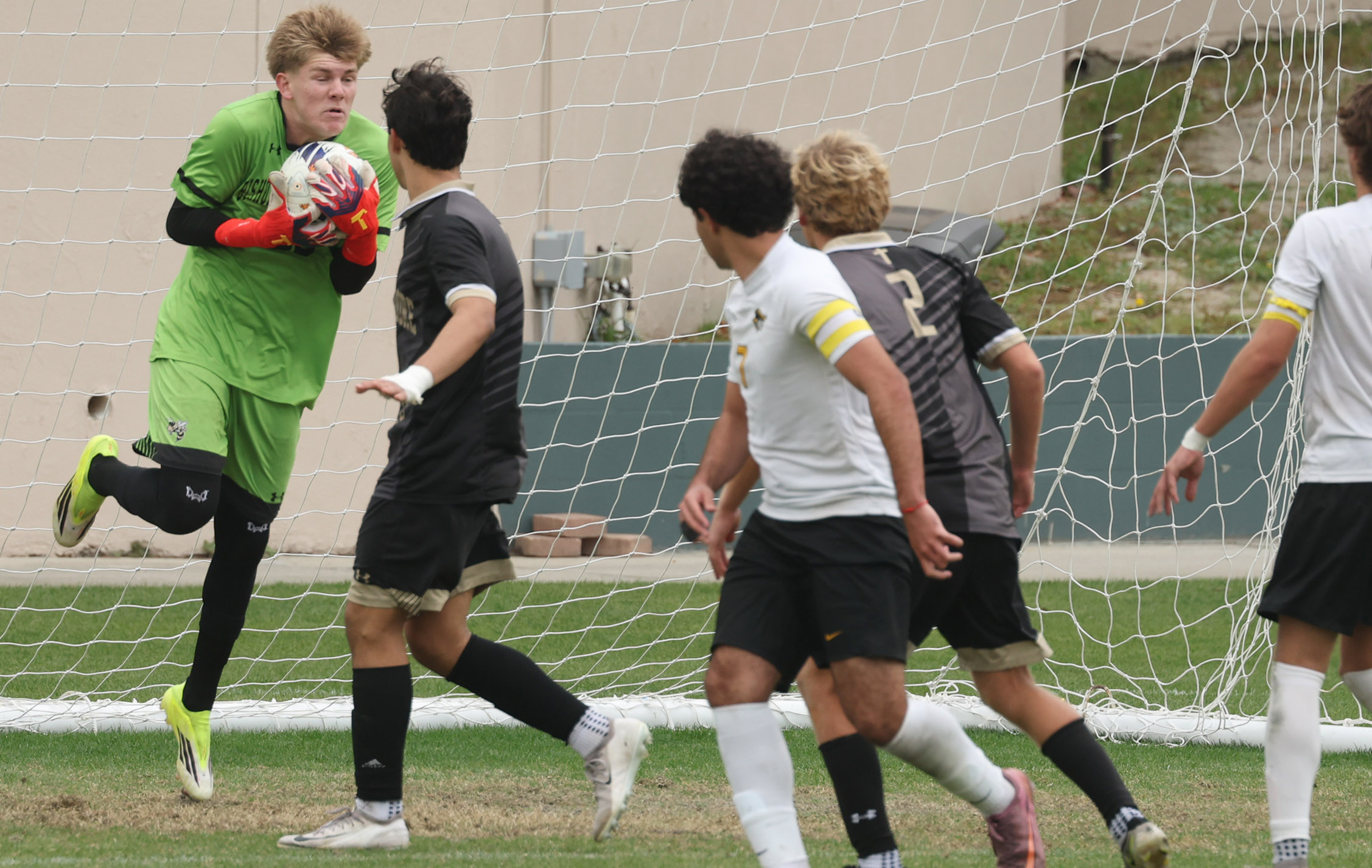 Bishop Moore Catholic High School goalkeeper Colin Norton (left) makes...