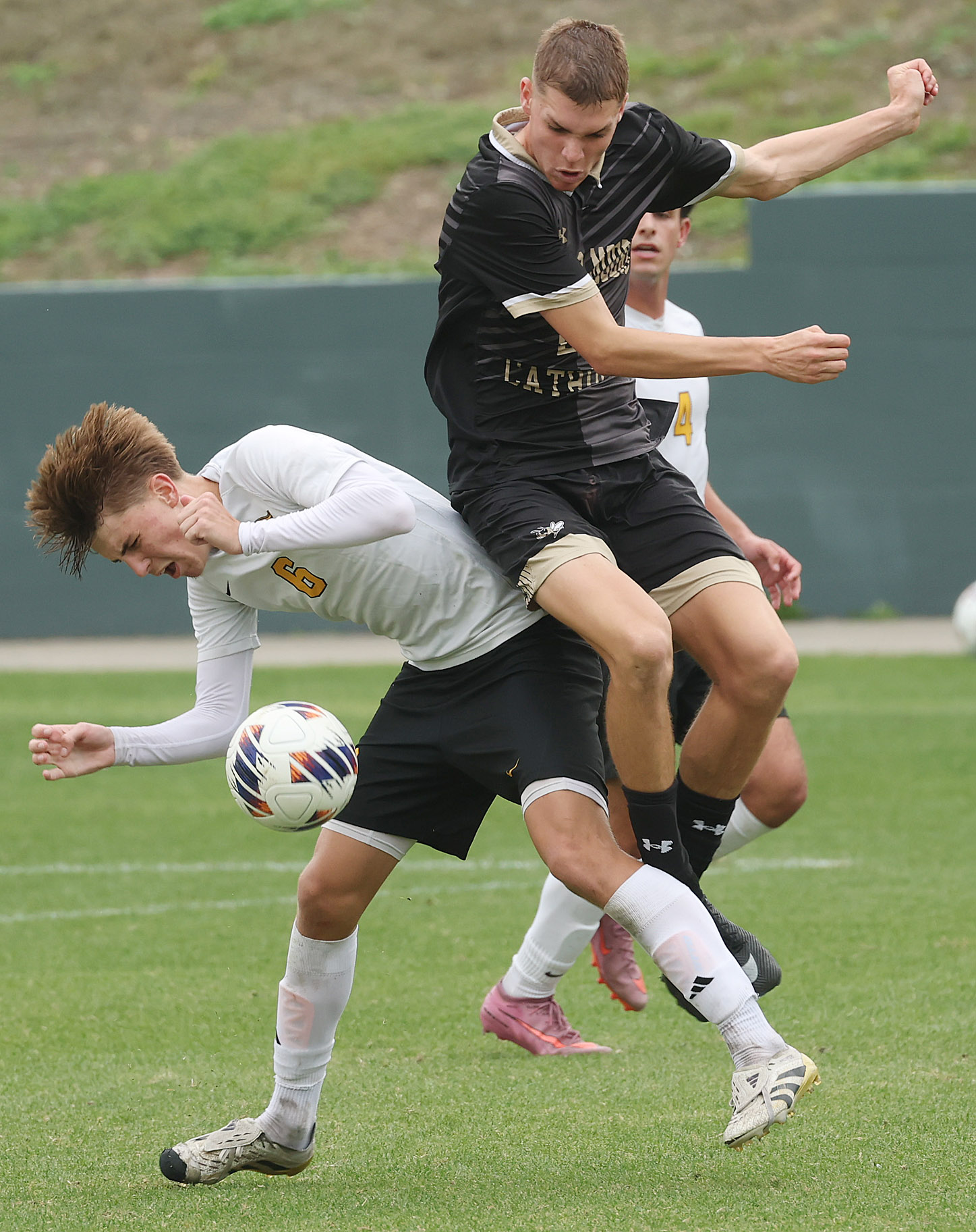 Bishop Moore Catholic High School soccer player Cooper Ball (top)...