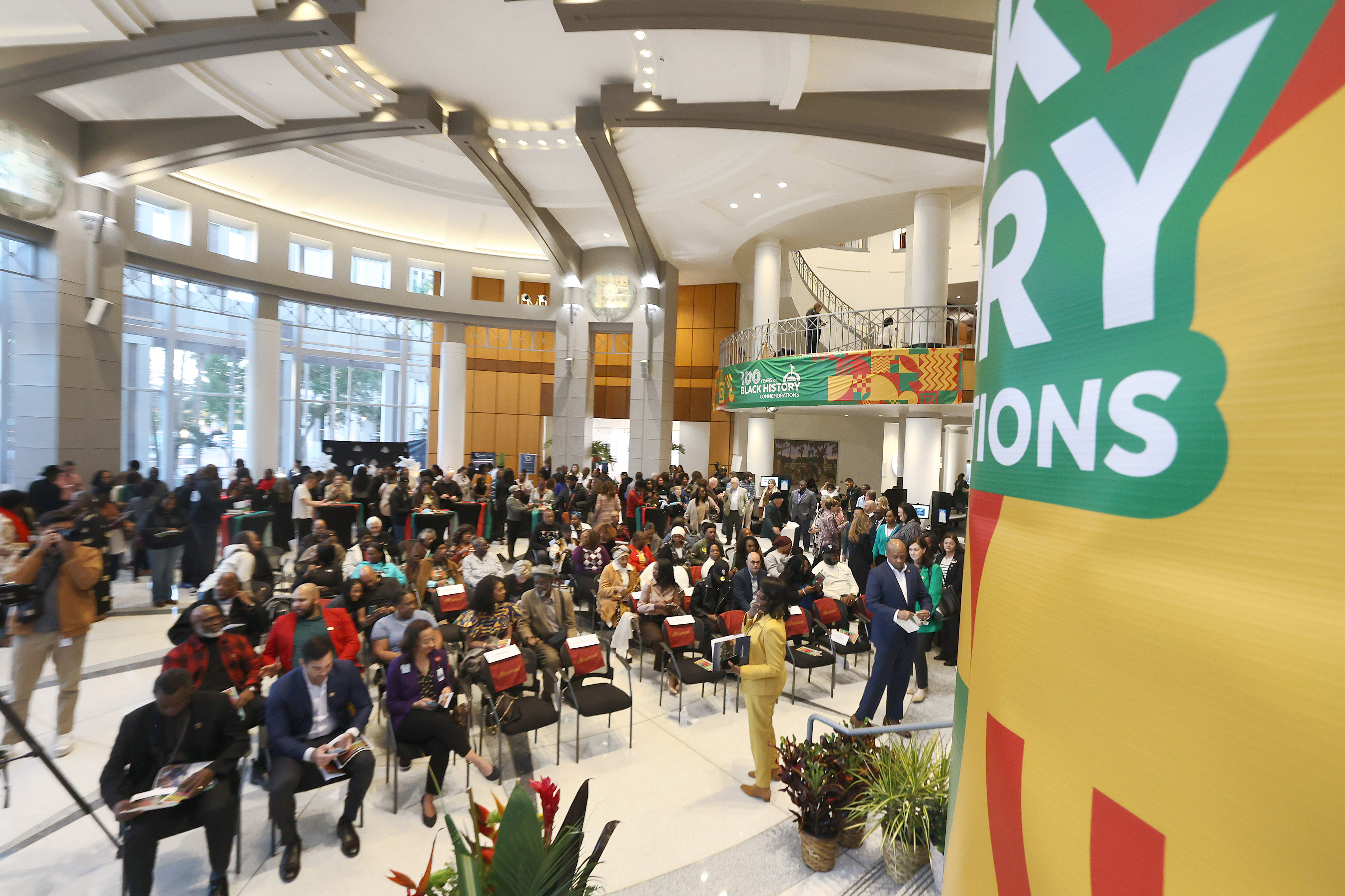 Visitors watch speakers during the Opening Reception of the City...