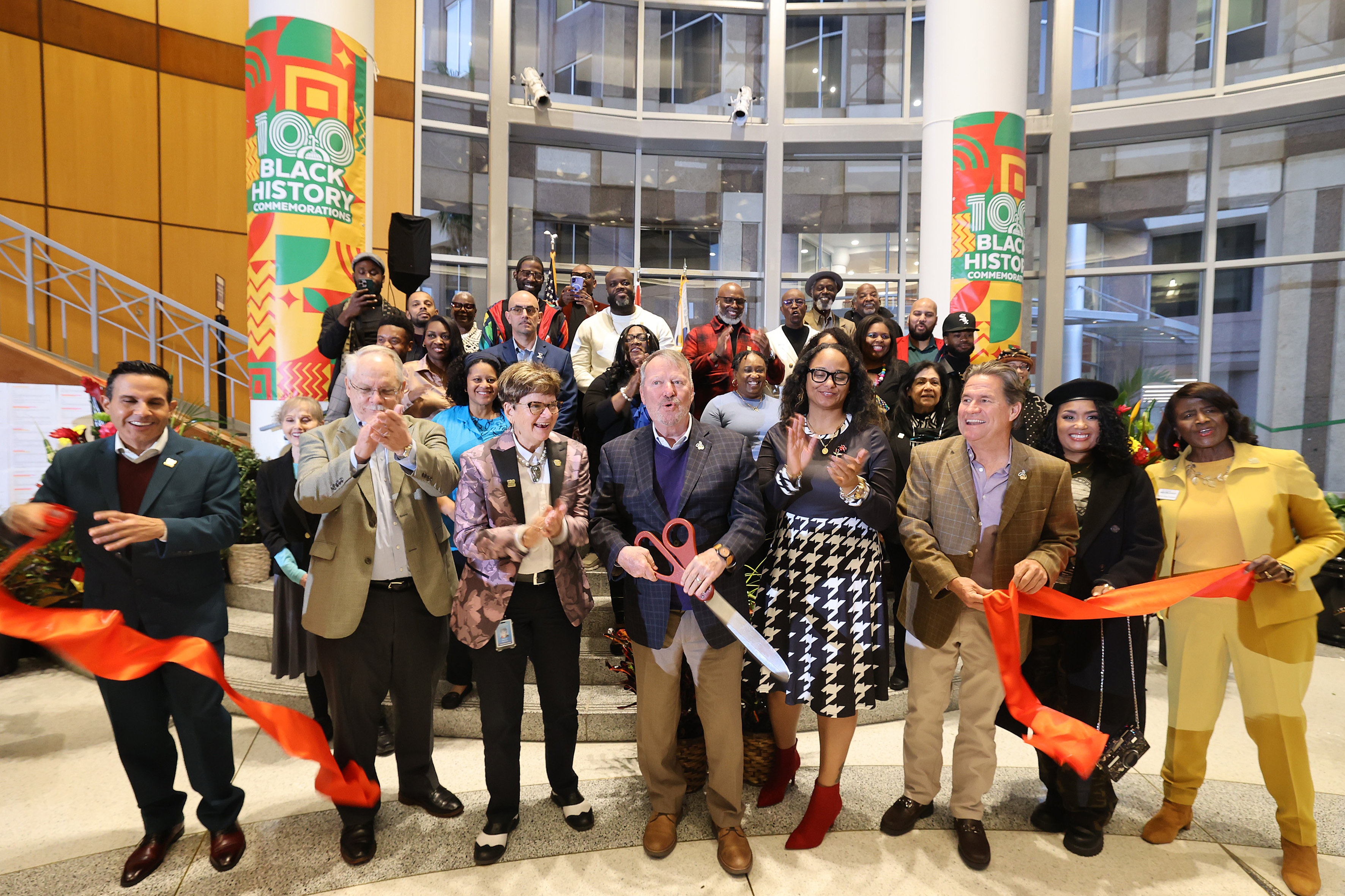 Orlando Mayor Buddy Dyer cuts the ribbon during the Opening...