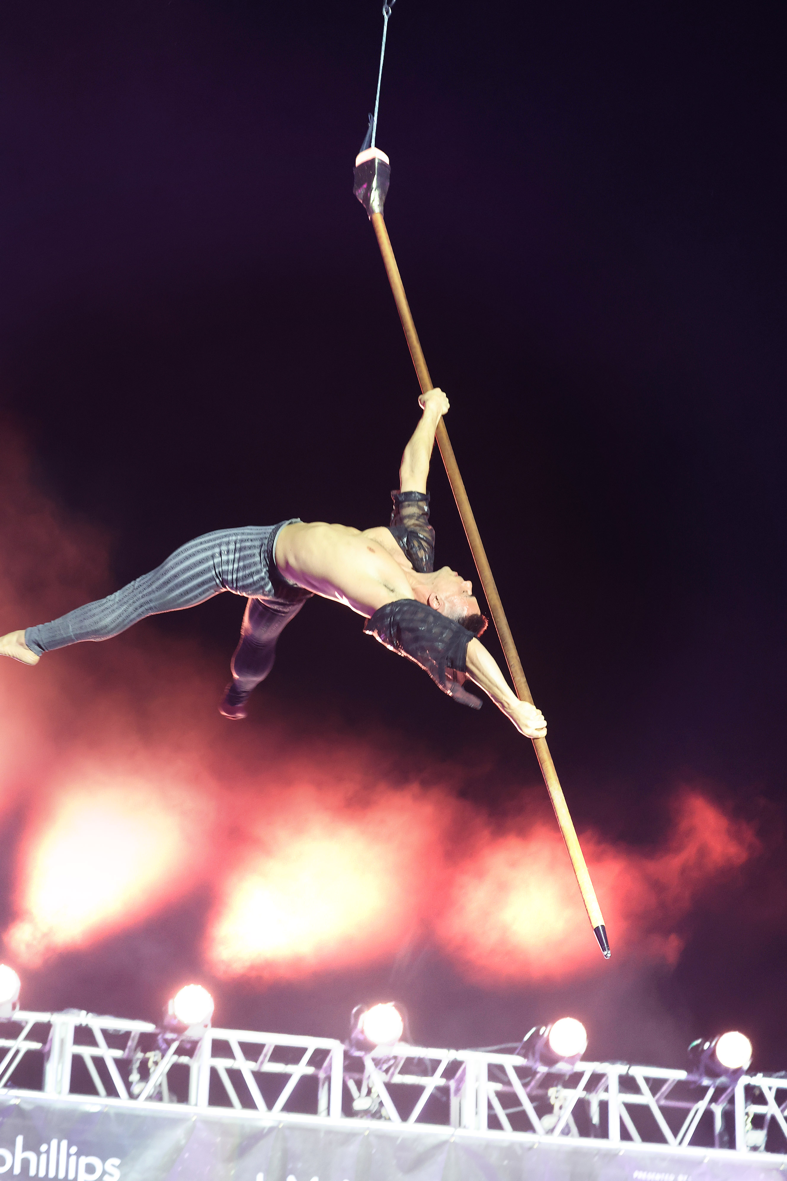 A Cirque du Soleil performer soars during a tech rehearsal...