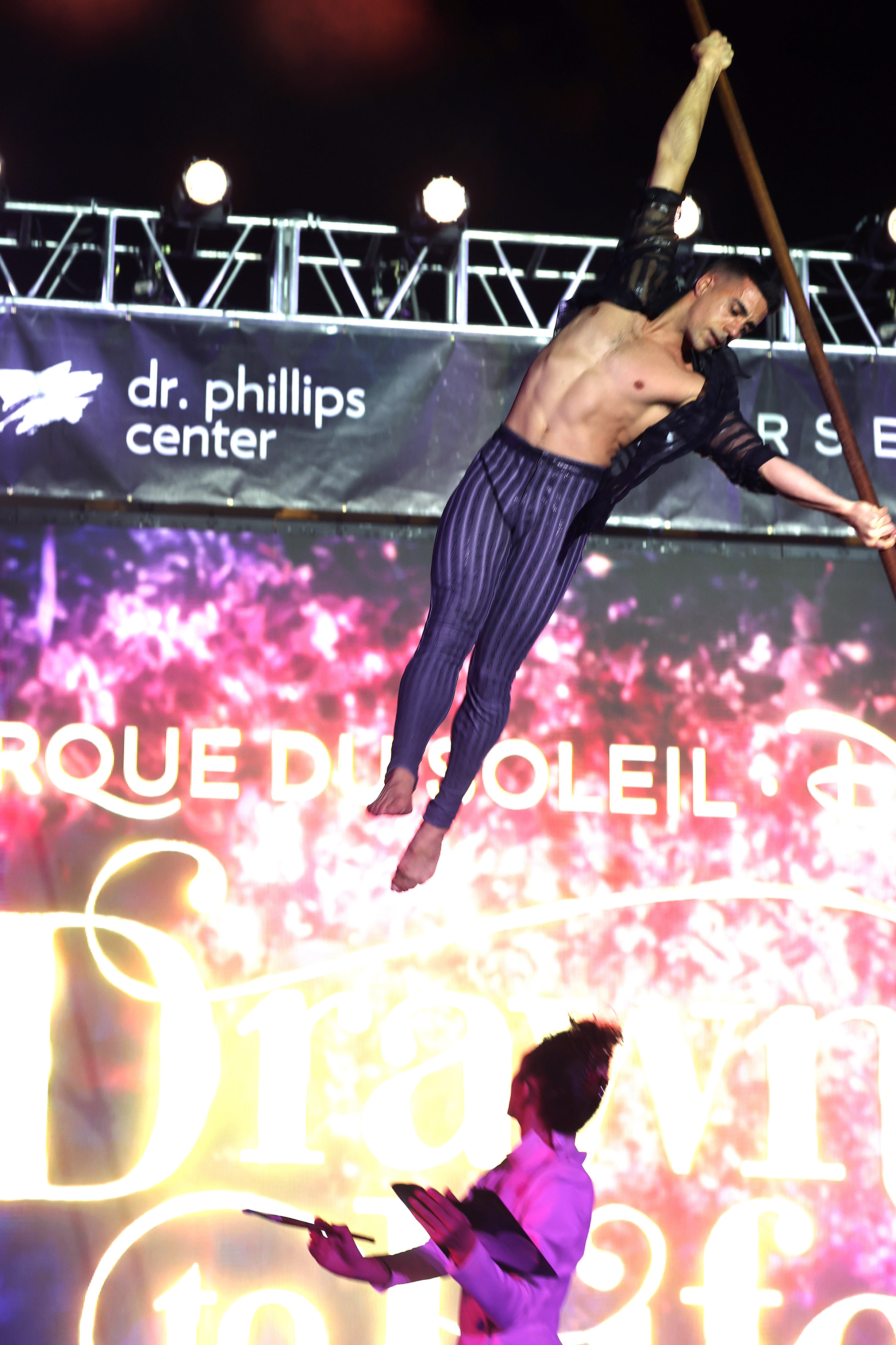 A Cirque du Soleil performer soars during a tech rehearsal...