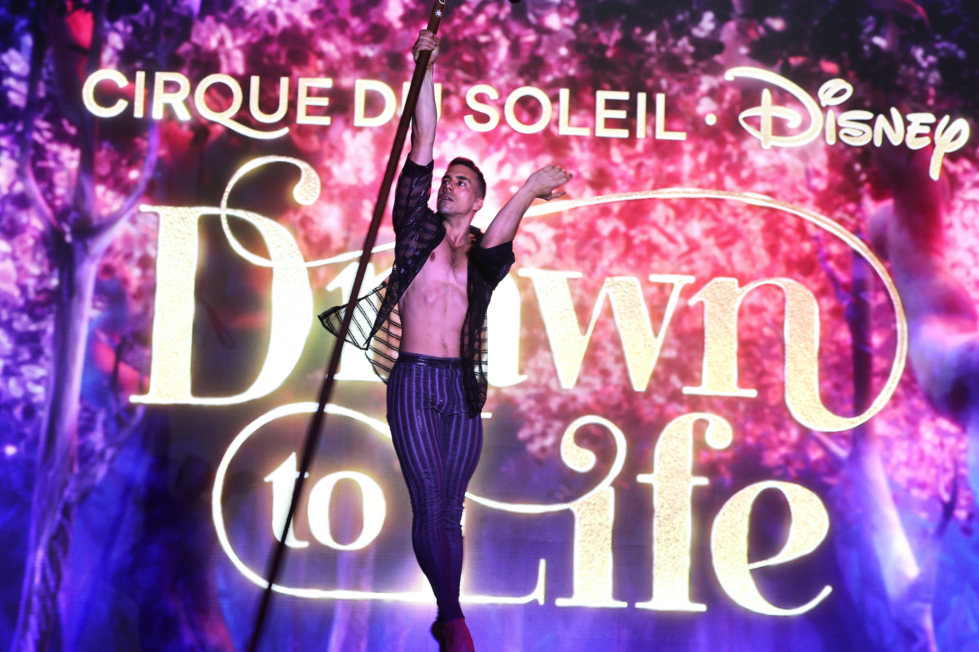 A Cirque du Soleil performer soars during a tech rehearsal...