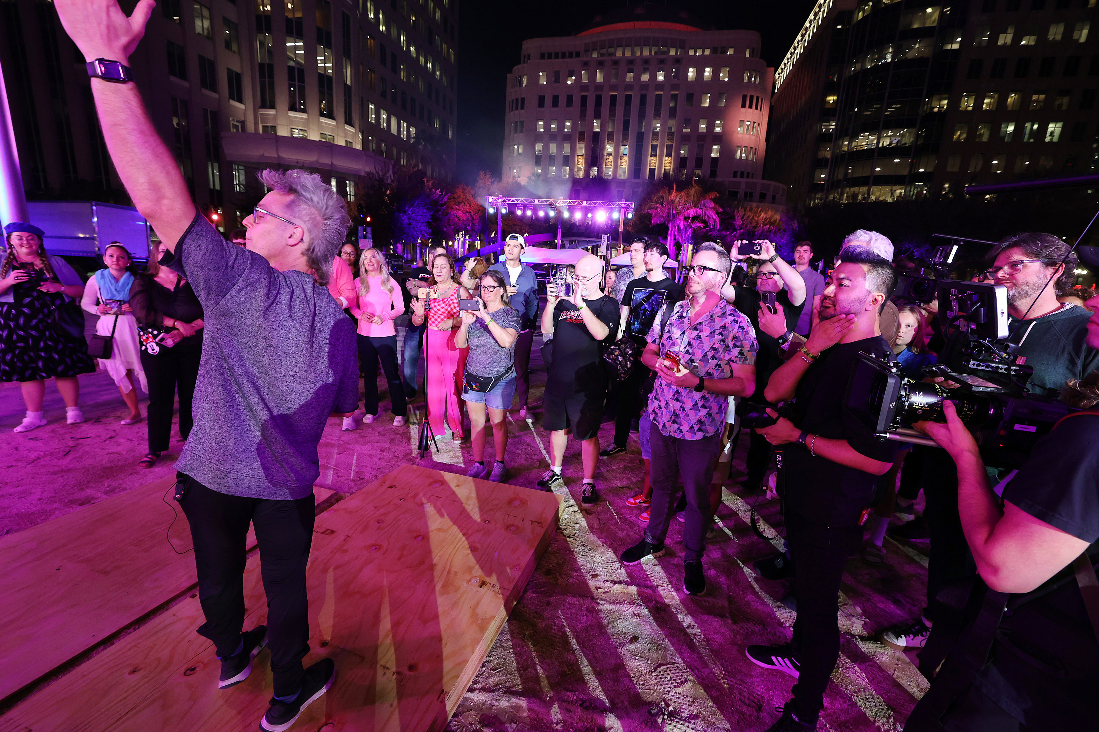 Attendees take photos during a tech rehearsal media preview of...