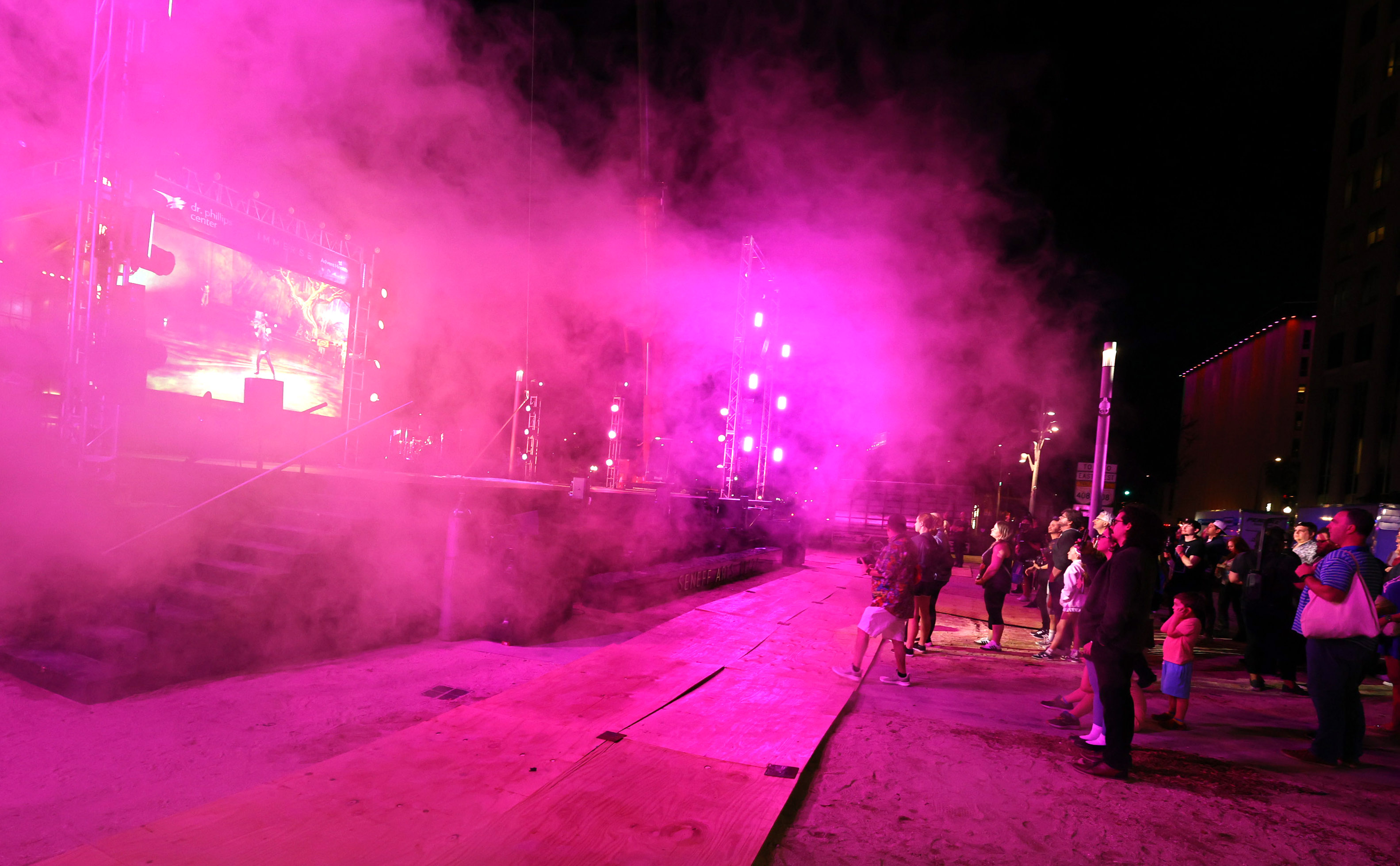 Lighted mist fills the air during a tech rehearsal media...