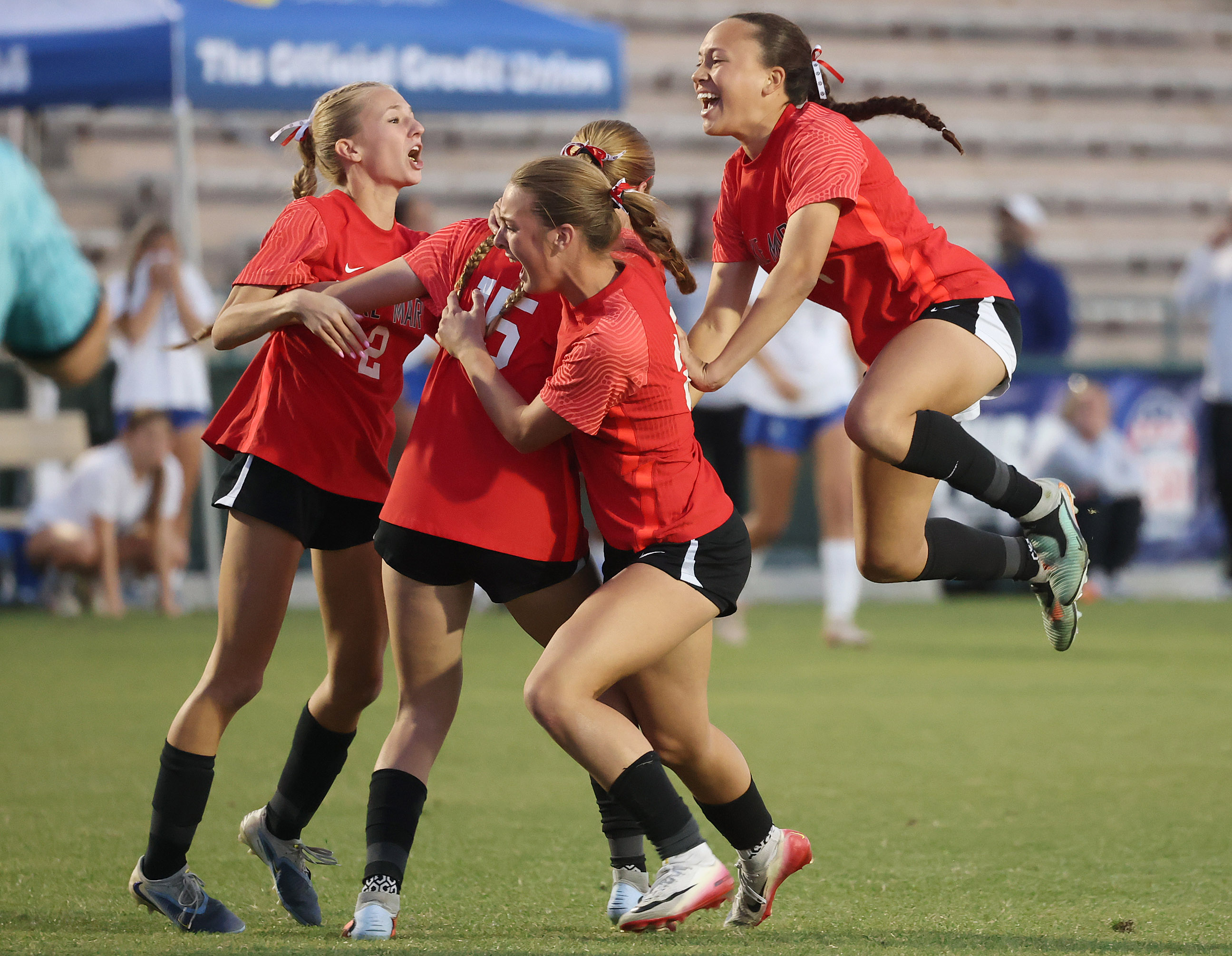 Lake Mary High girls soccer players celebrate after winning the...