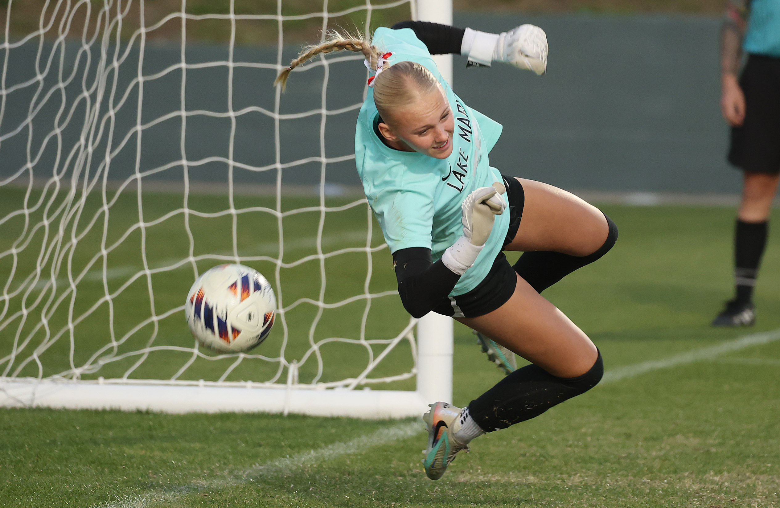 Lake Mary High goalkeeper Lily Ellis makes an athletic save...