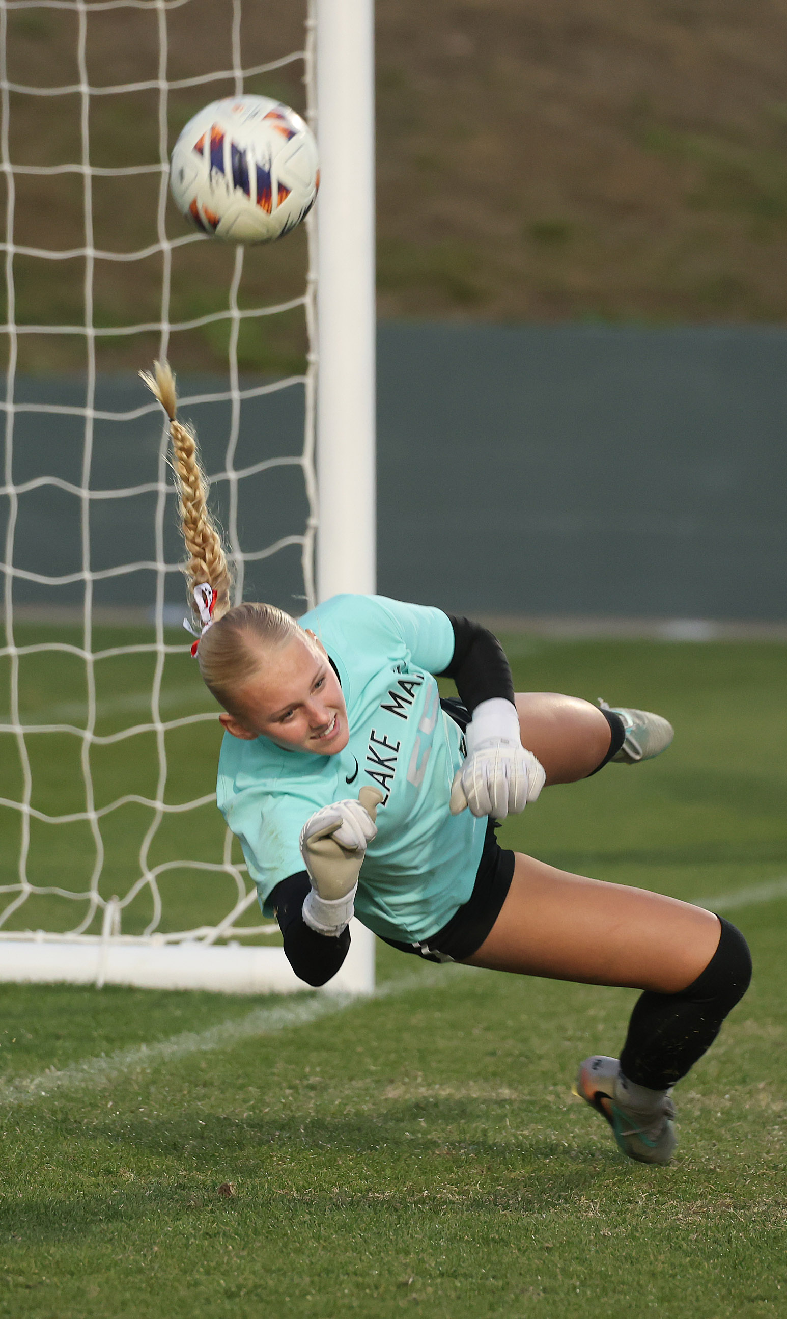 Lake Mary High goalkeeper Lily Ellis makes an athletic save...