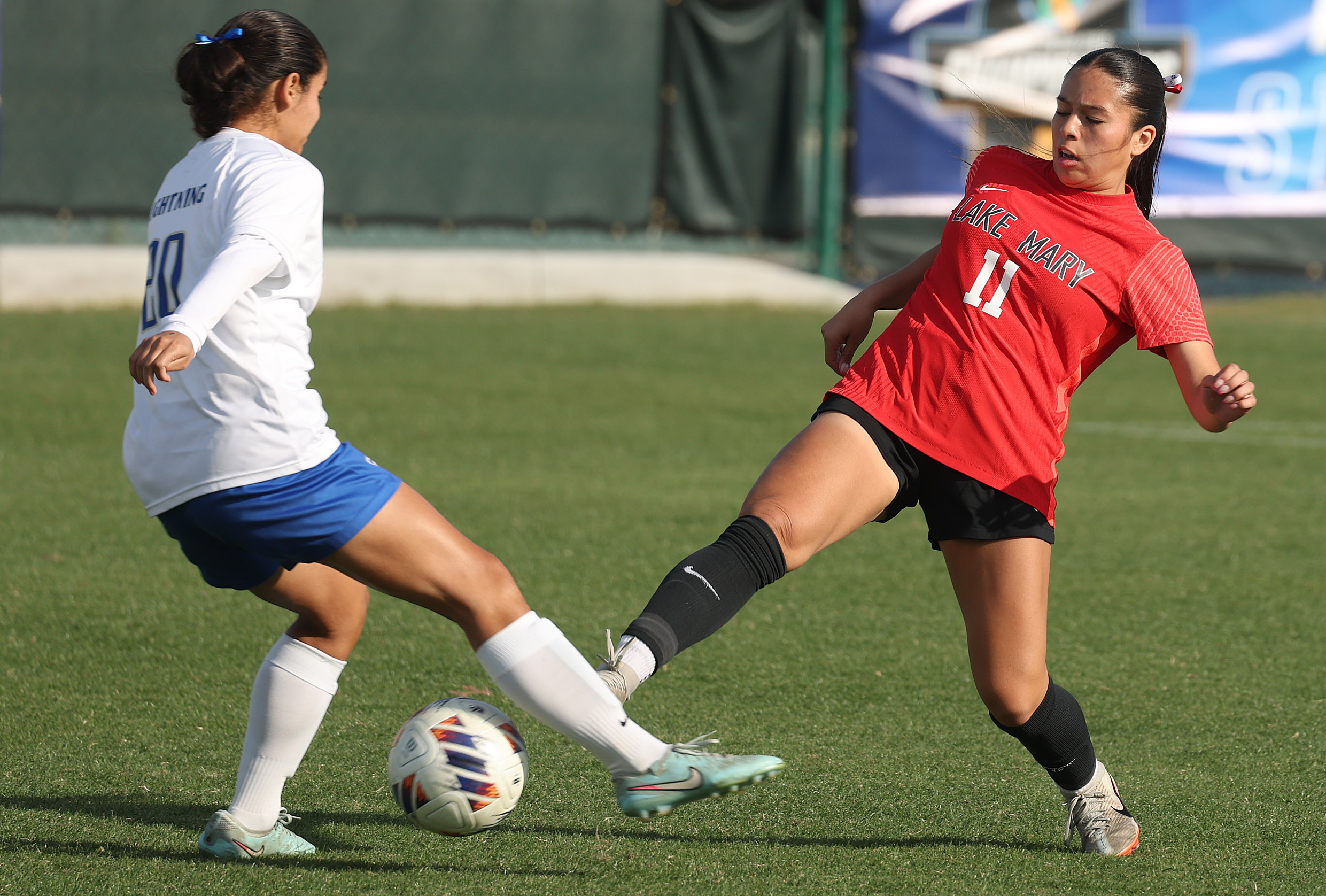 Lake Mary High player Ailany Rodarte (11) and Cypress Bay...