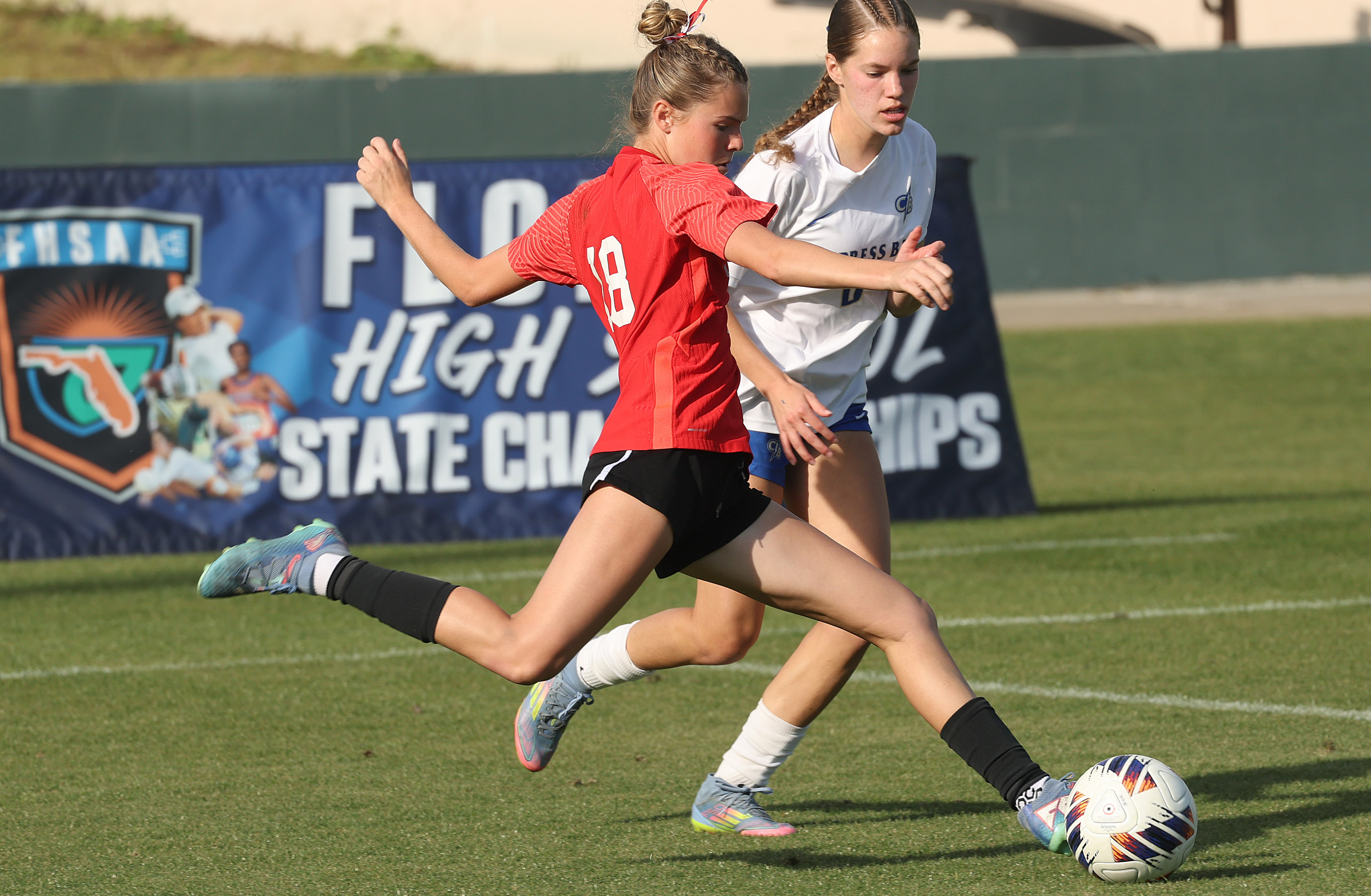 Lake Mary High player Teagan Jahns (18) kicks during the...