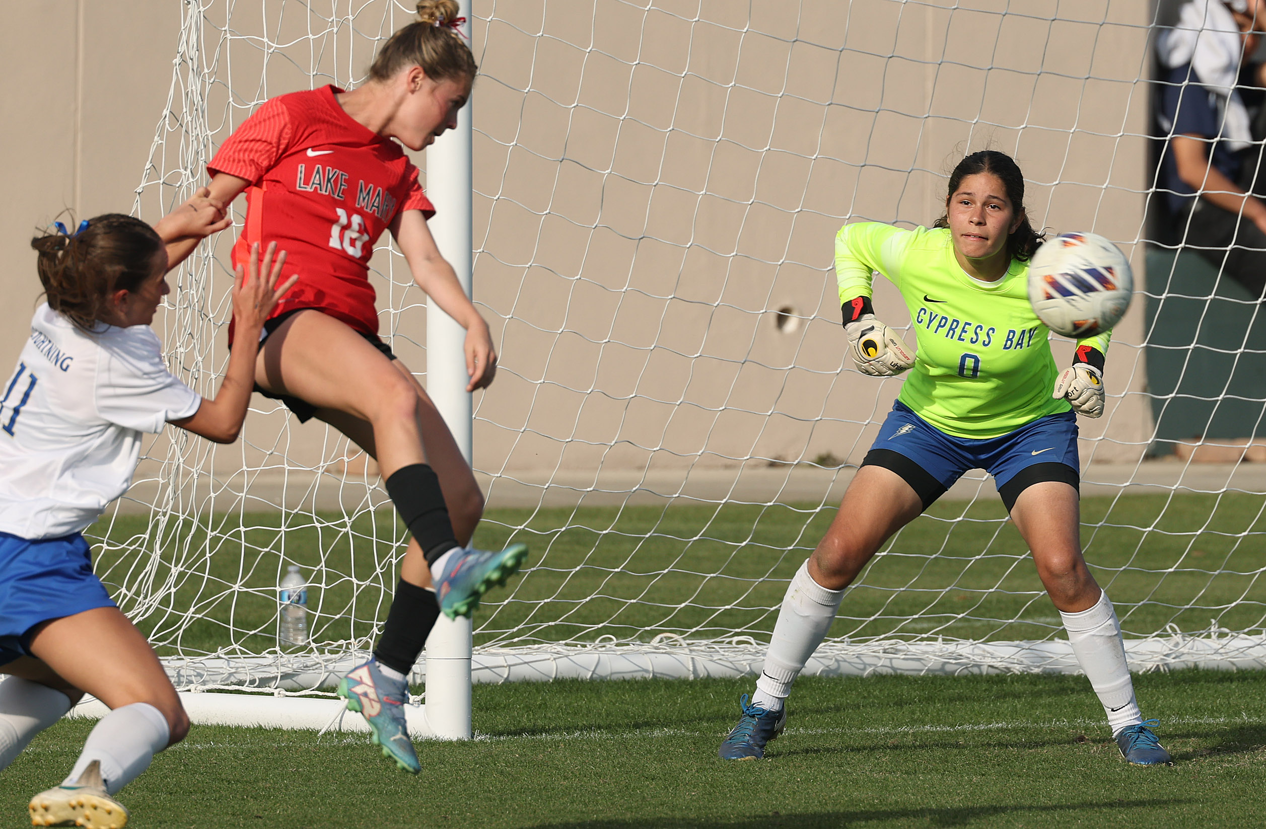 Lake Mary High player Teagan Jahns (18) nearly scores a...