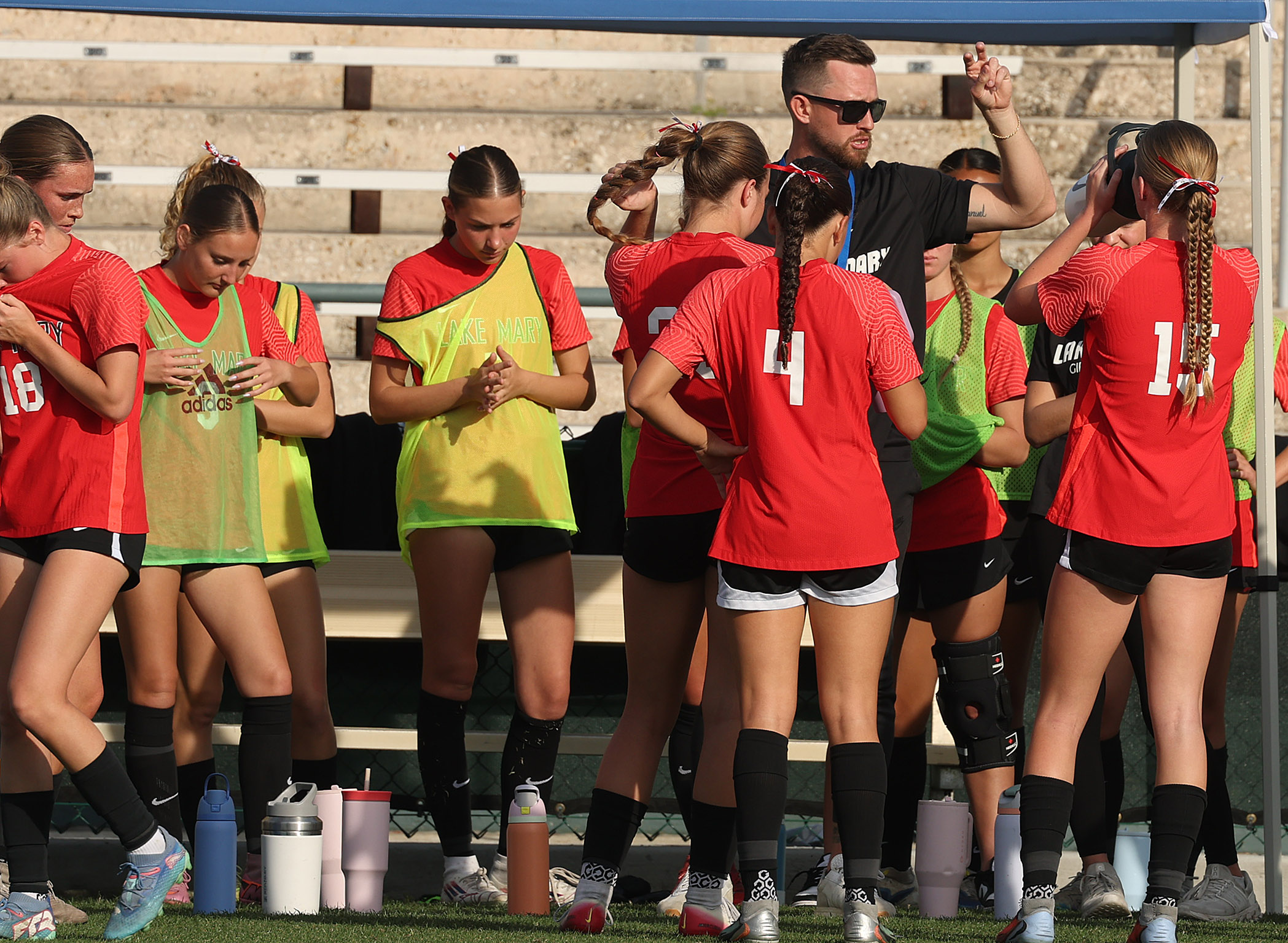 Lake Mary High coach Christian Eissele coaches players during the...