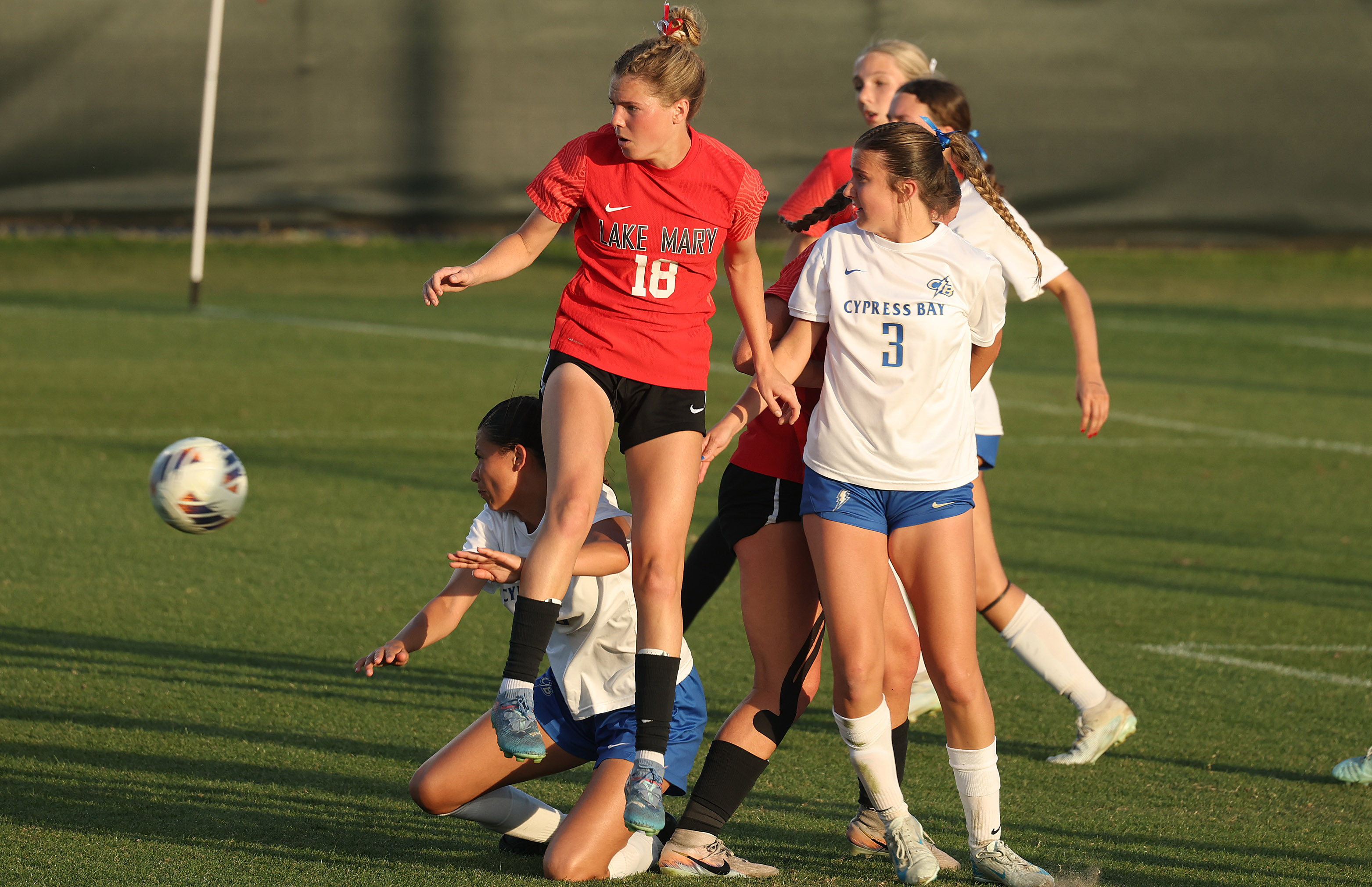 Lake Mary High player Teagan Jahns (18) keeps the ball...