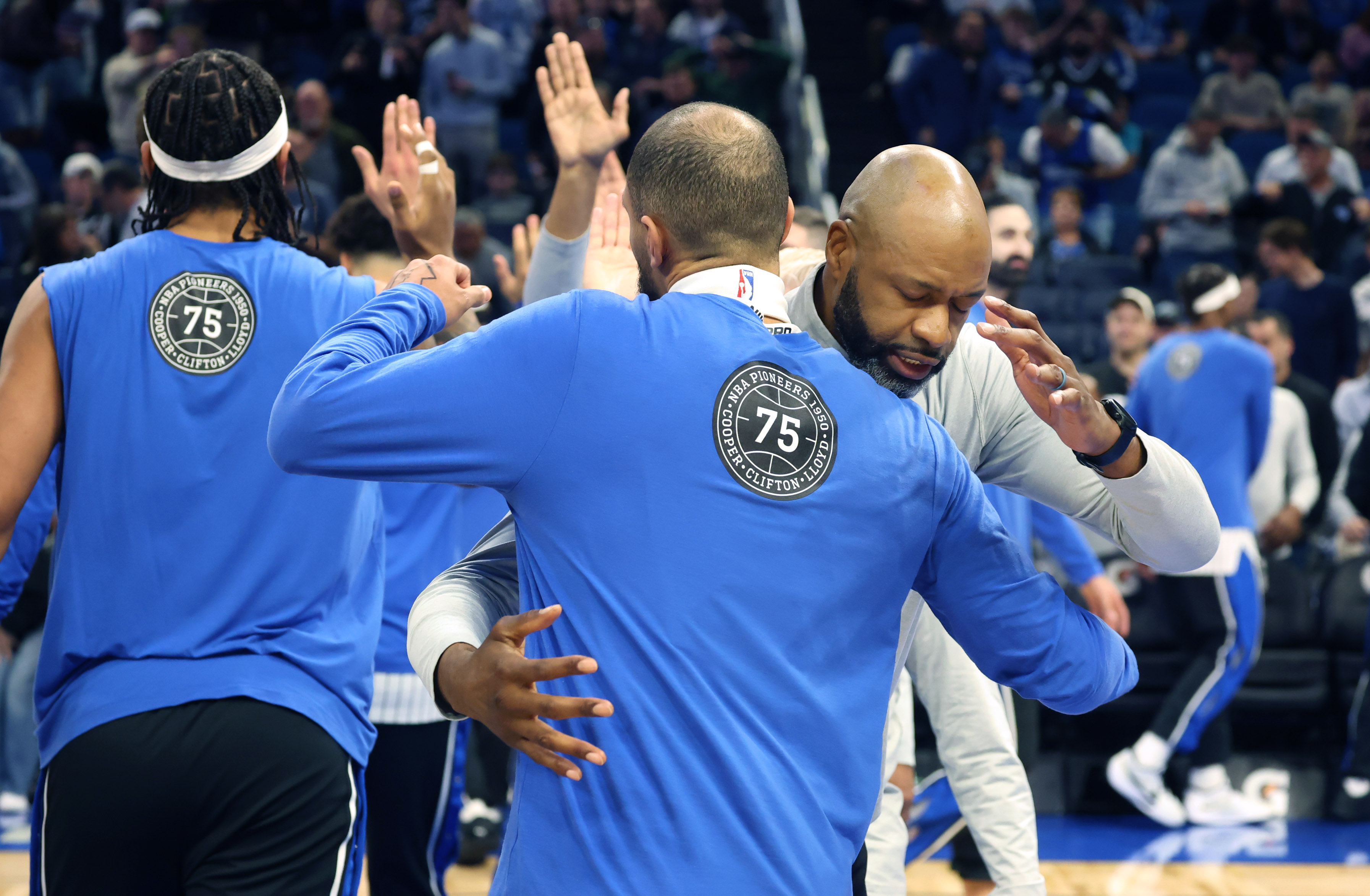 Orlando head coach Jamahl Mosley greets players before the Milwaukee...