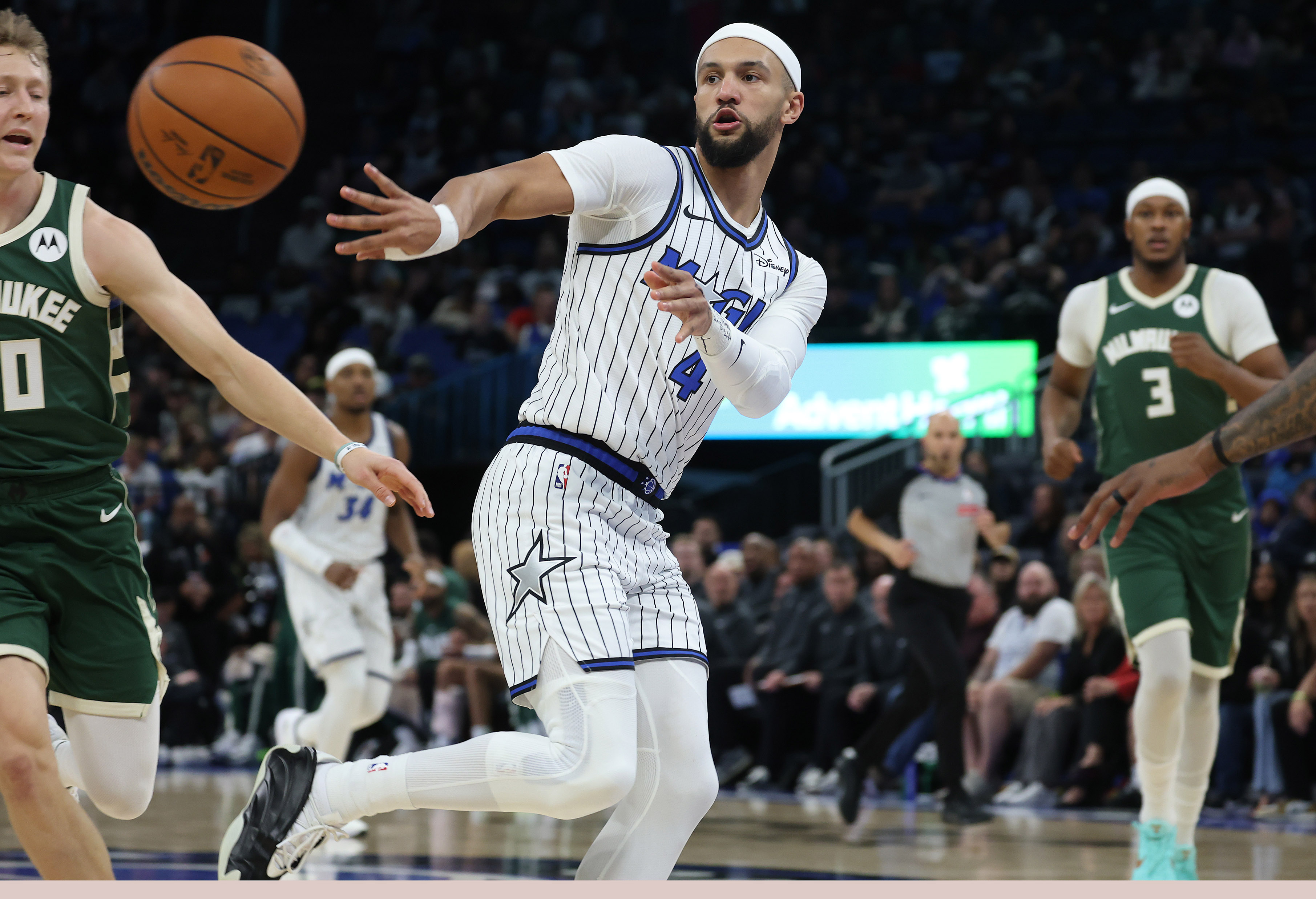 Orlando guard Jalen Suggs passes during the Milwaukee Bucks at...