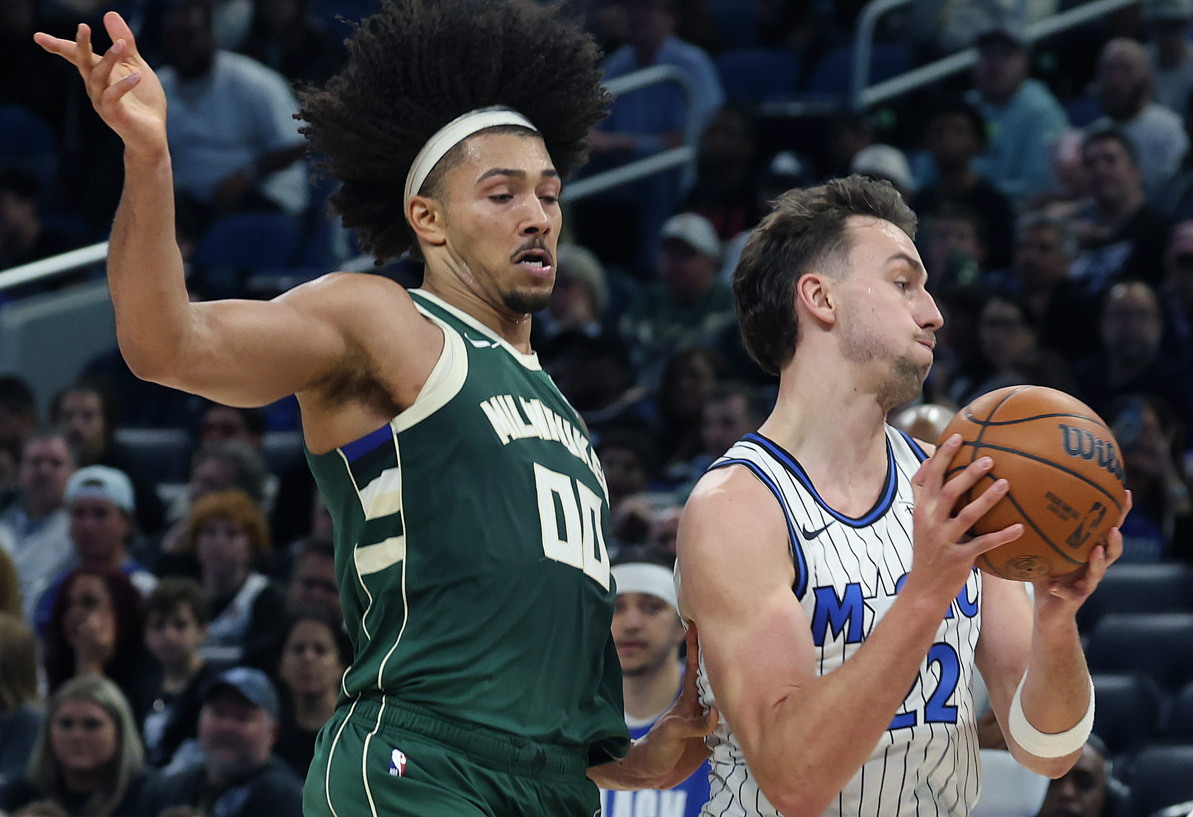 Orlando forward Franz Wagner (22) controls the ball in front...
