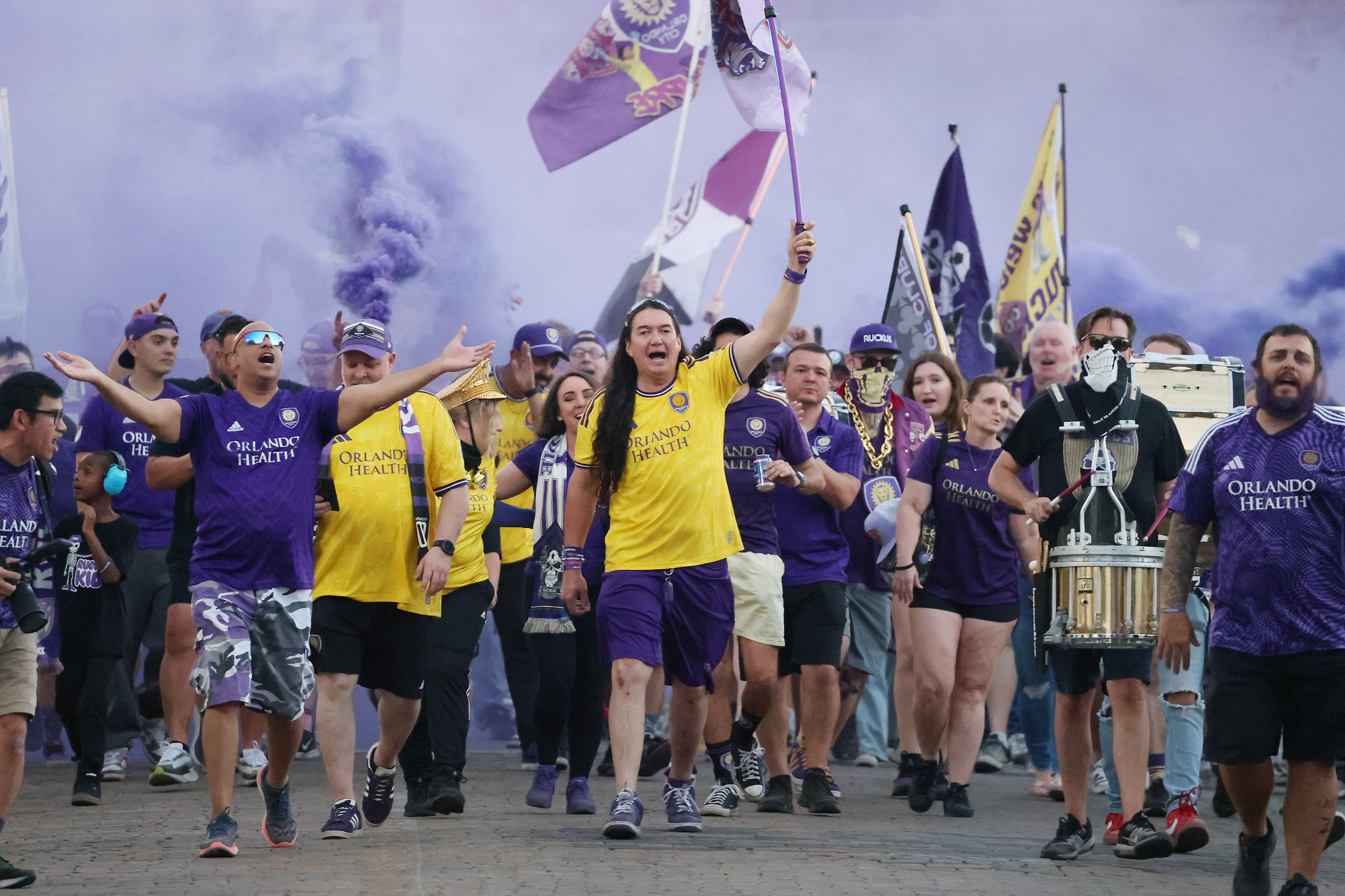 Orlando. City fans march in before the New York Red...
