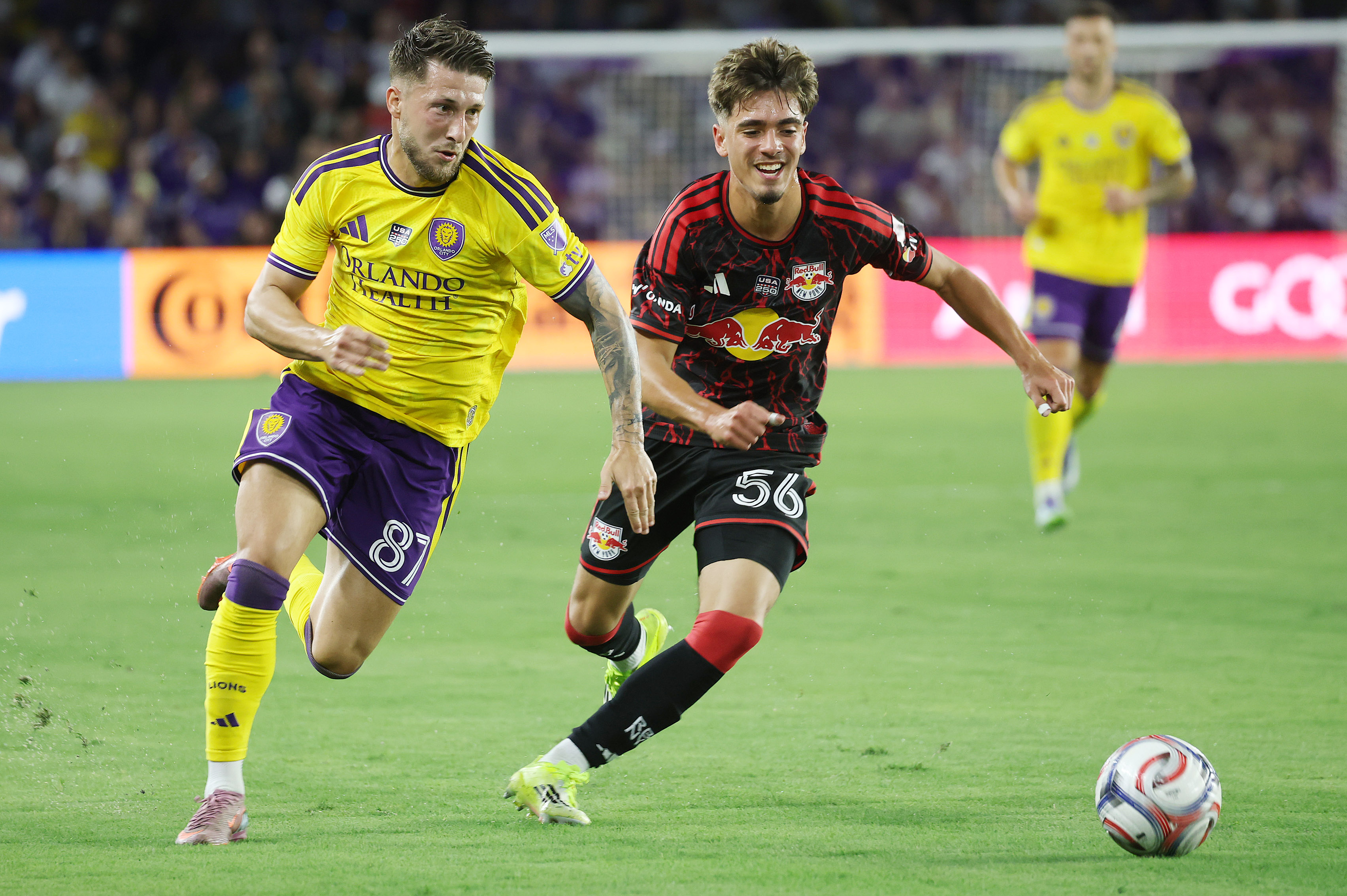 Orlando player Marco Palasic (87) and New York player Matthew...