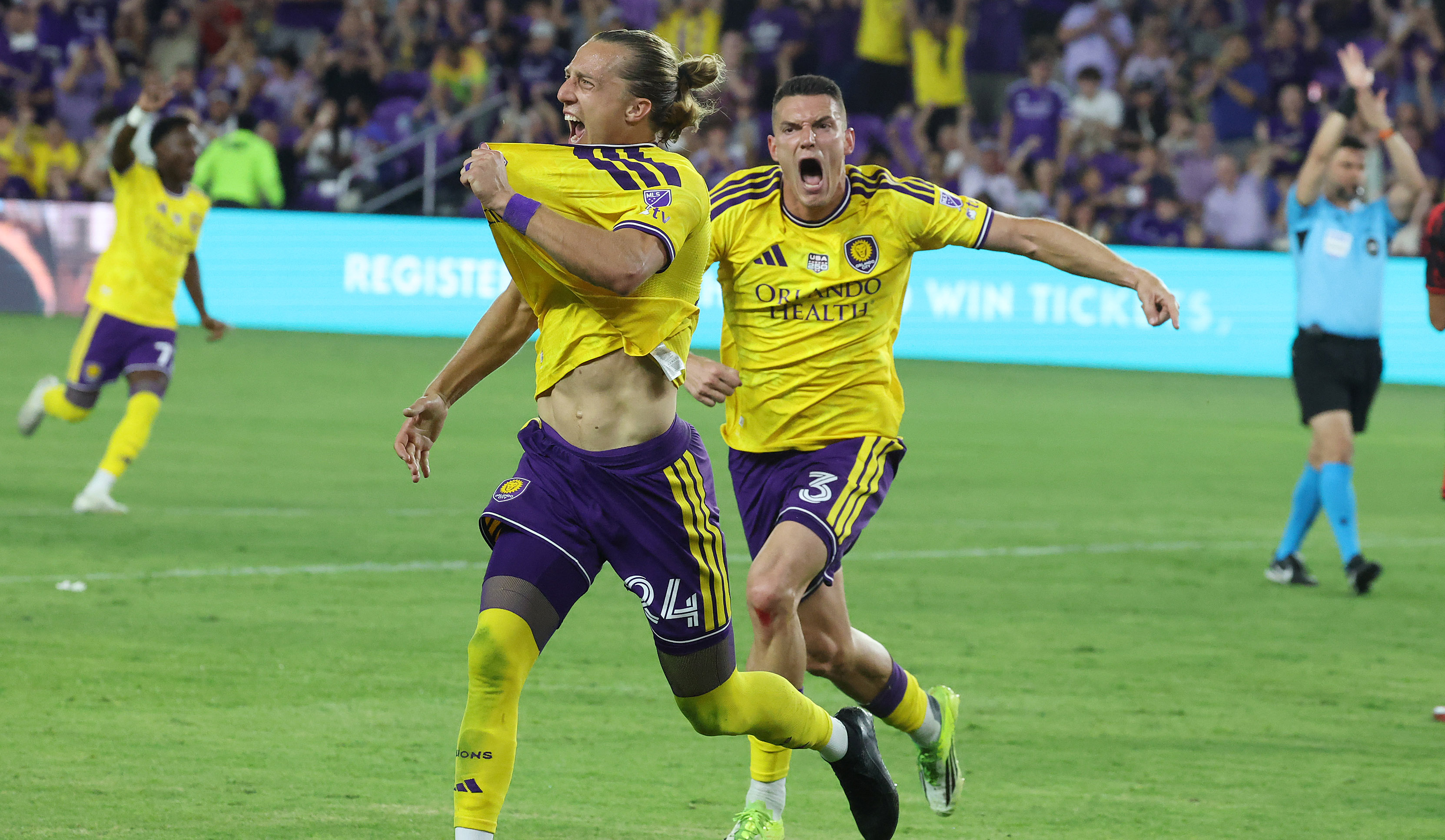 Orlando City players Griffin Dorsey (24) and Adrian Marin (3)...