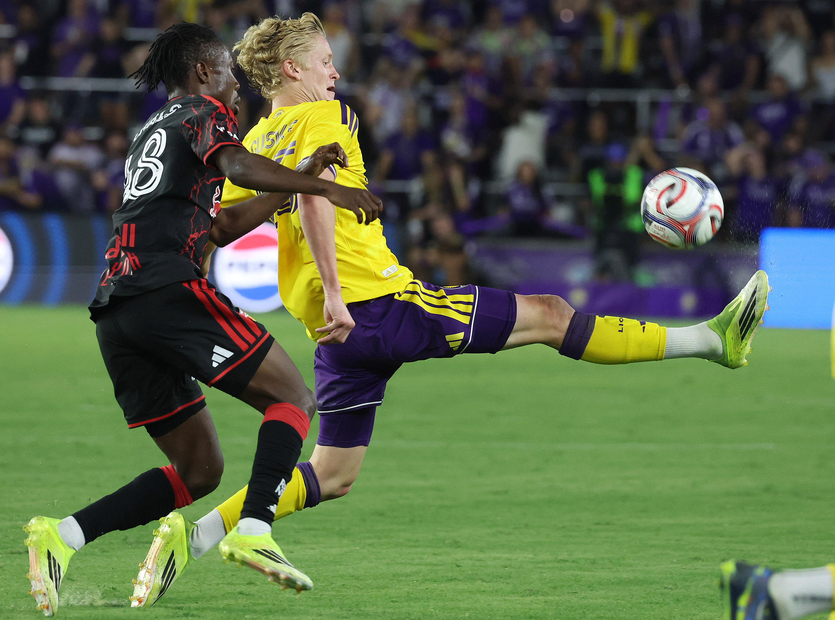 Orlando City player Colin Guske (25) kicks during the New...