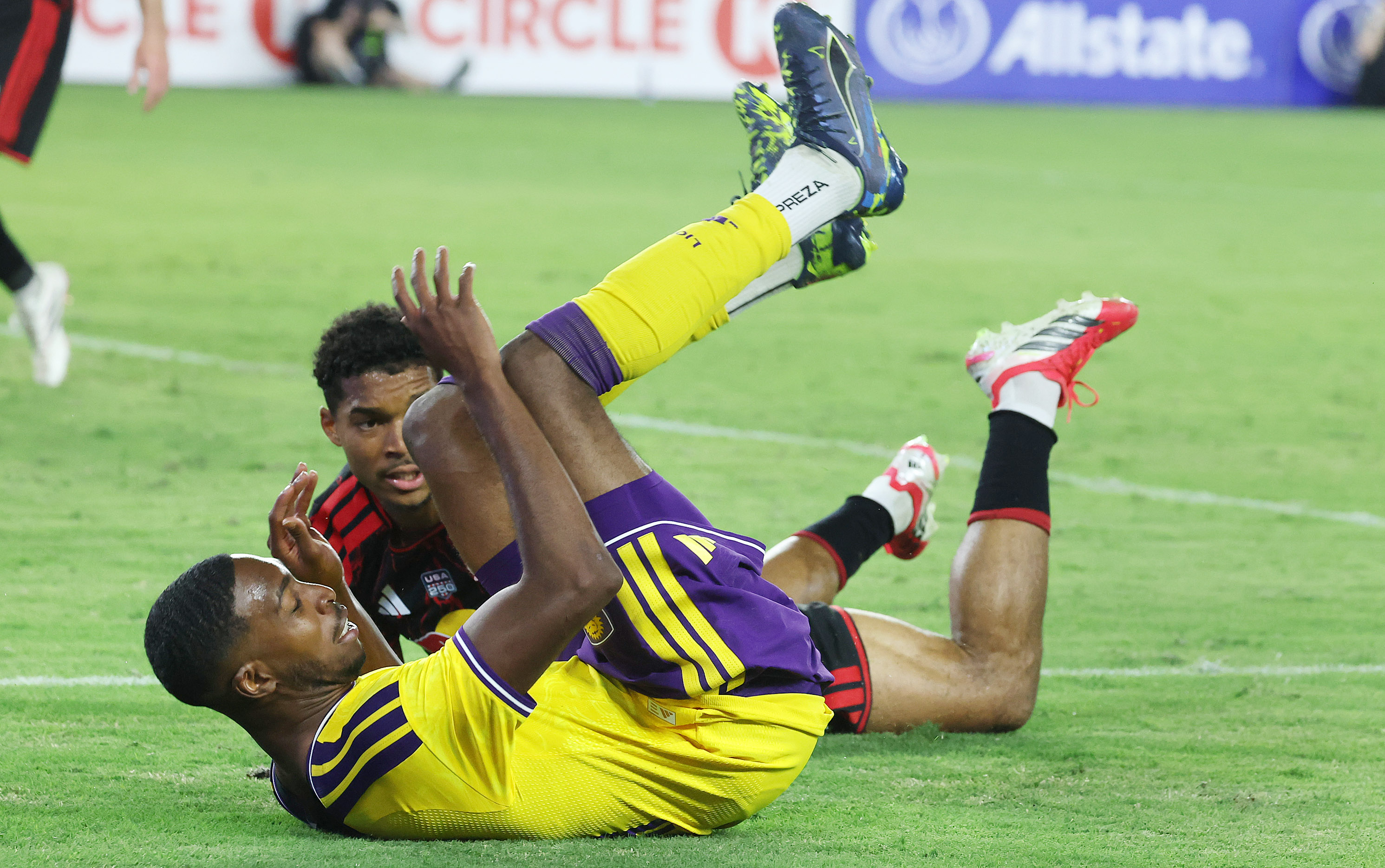 Orlando player Tyrese Spicer tumbles during the New York Red...