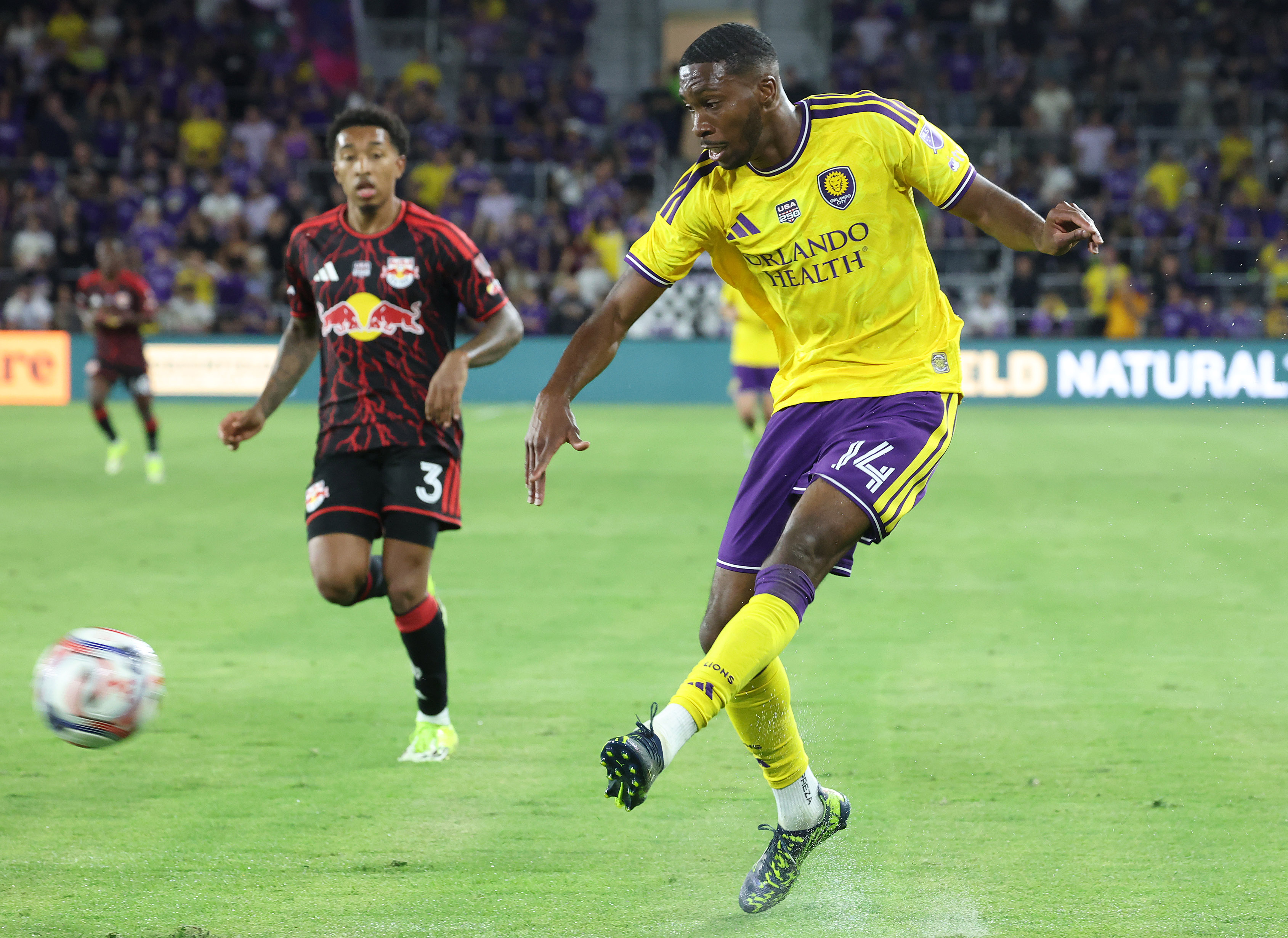 Orlando City player Tyrese Spicer (14) kicks during the New...
