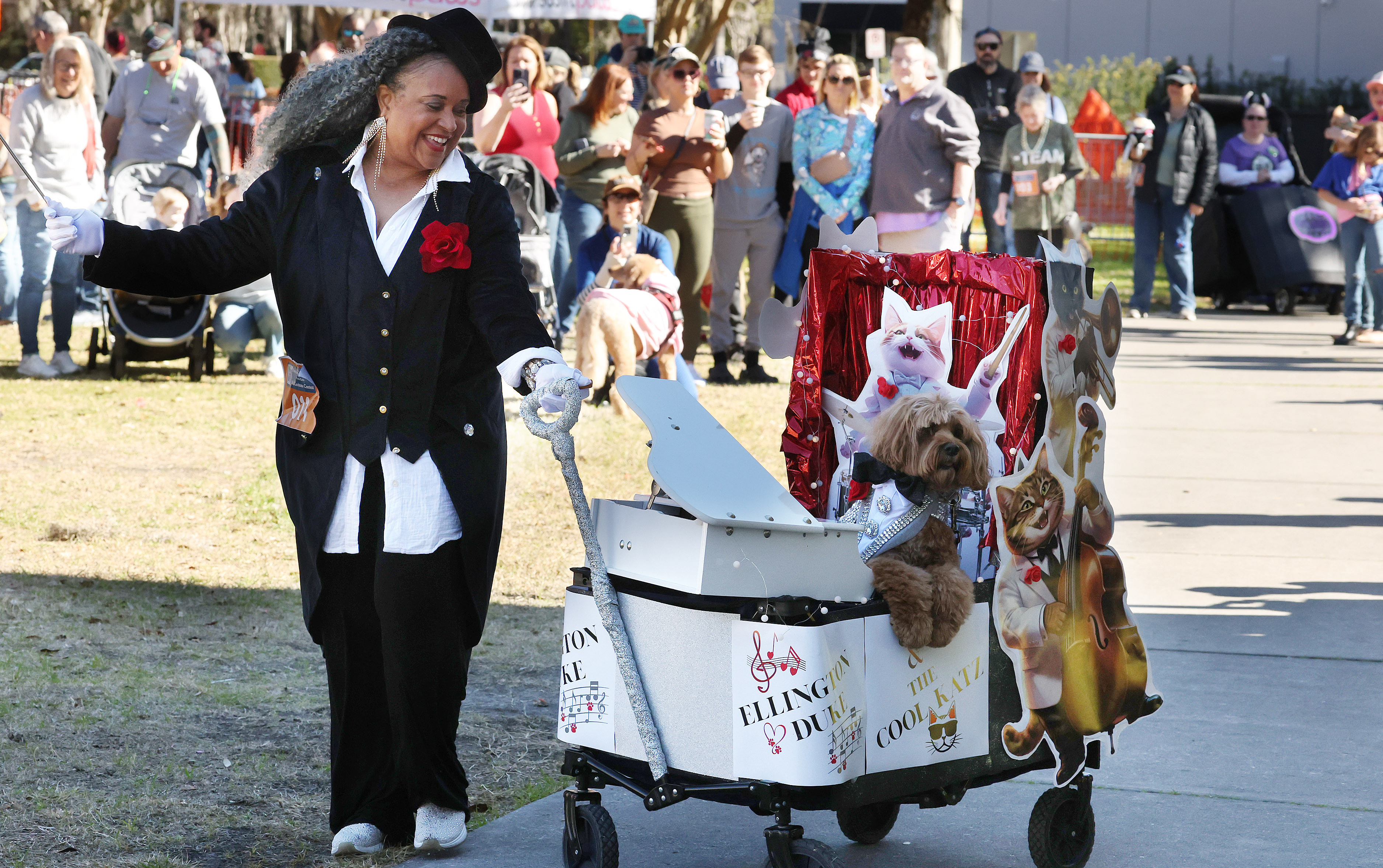 Ericka Cotton, left, conducts her dog, 